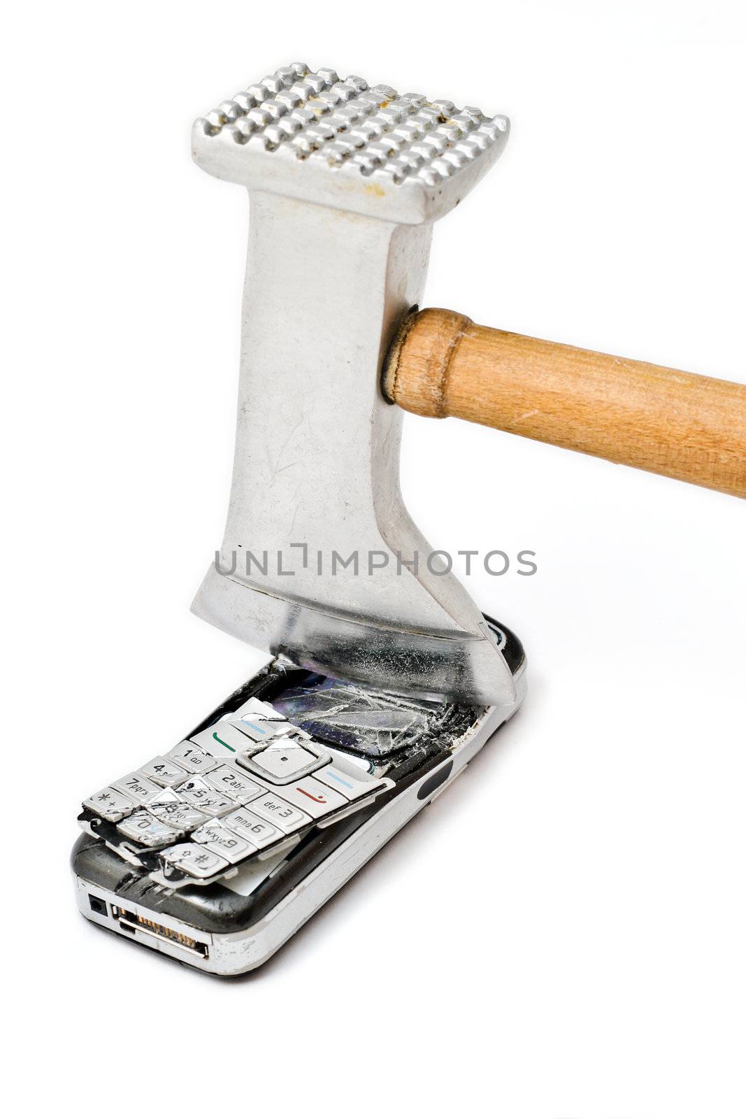 Meat tenderizer smashing cellular phone isolated on the white background