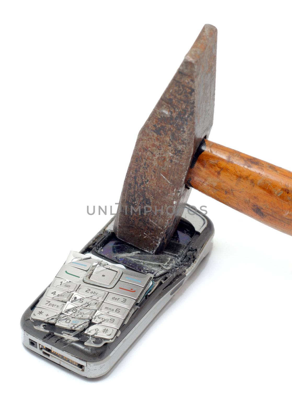 Hammer smashing cellular phone isolated on the white background