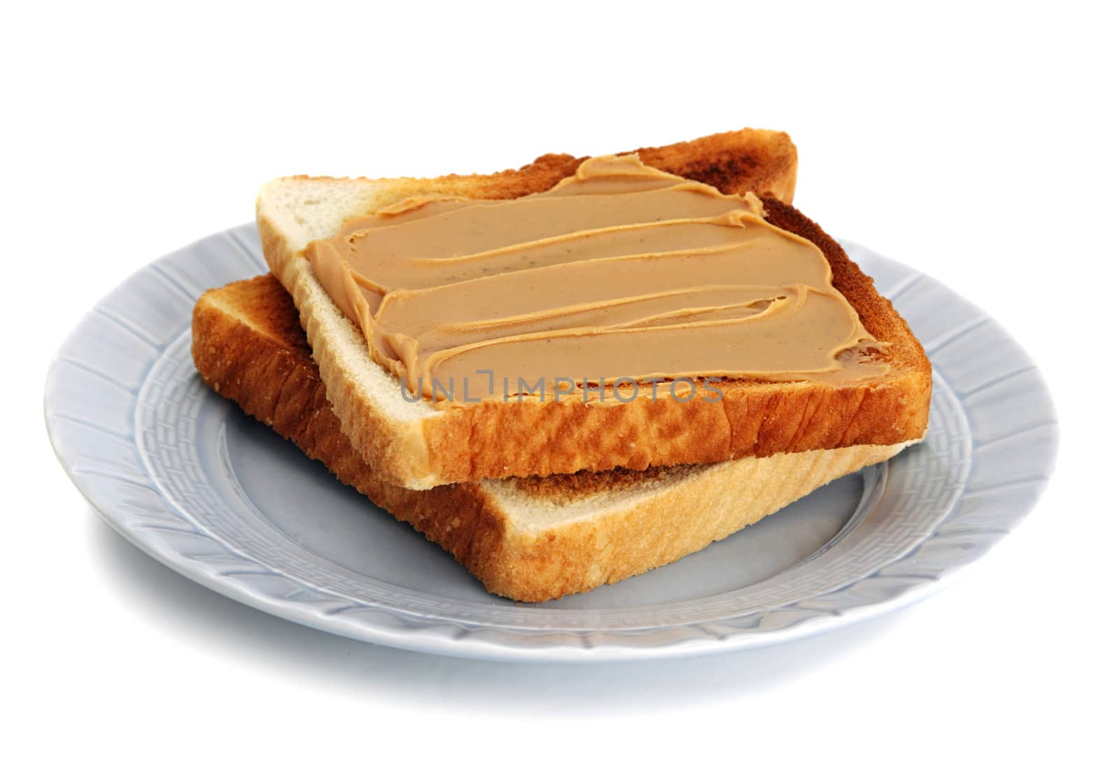 peanut butter toast in blue plate, white background