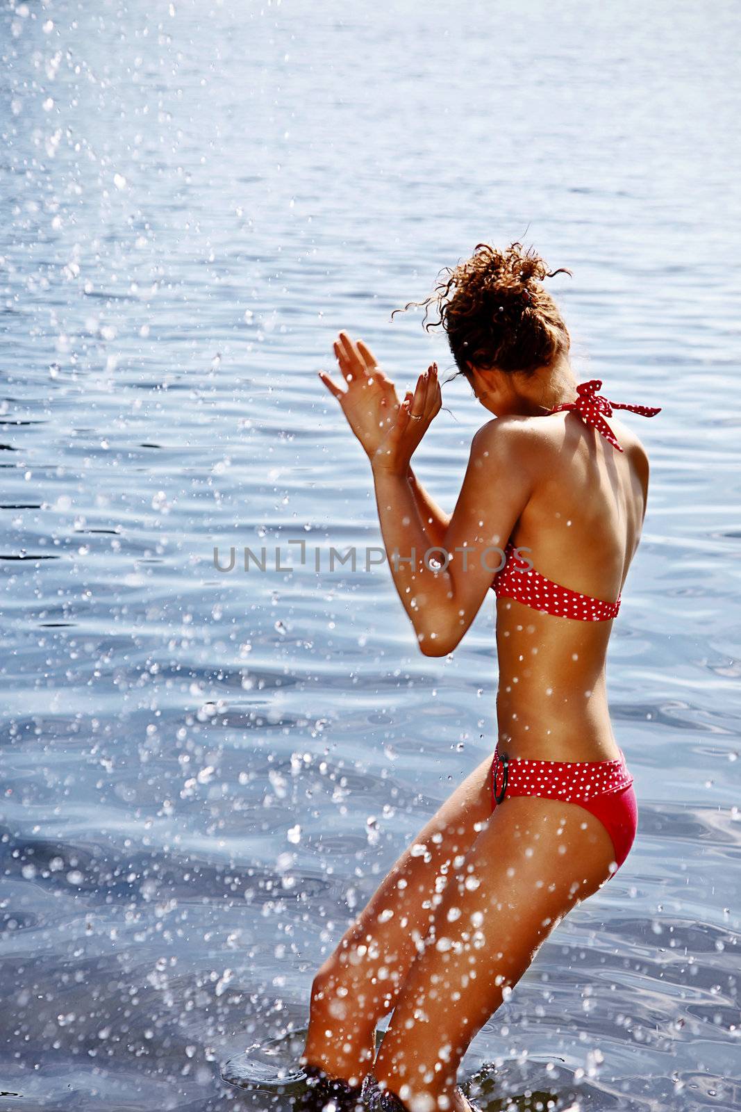 Sexy Slim Girl Dodging The Water Splashes