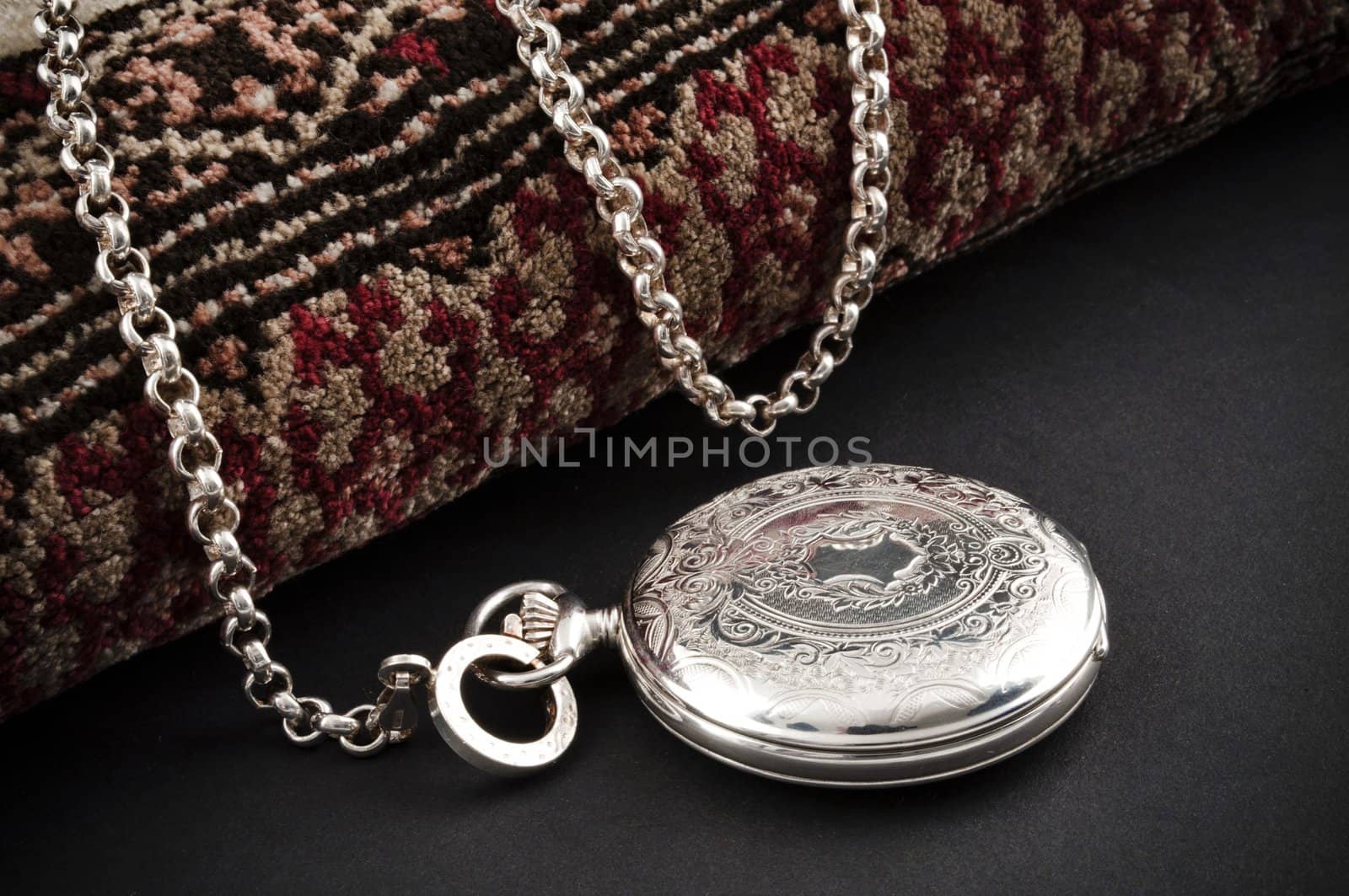 Closed silver pocket watch by rigamondis