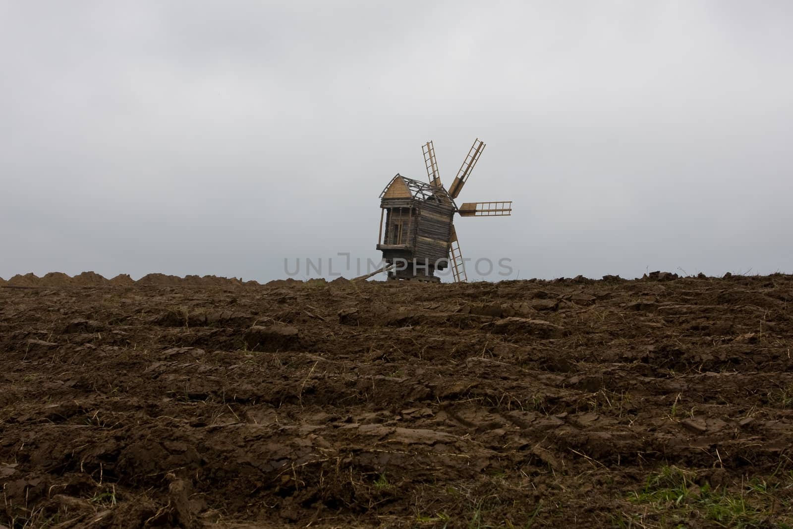 The Mill on the background of the broken ground