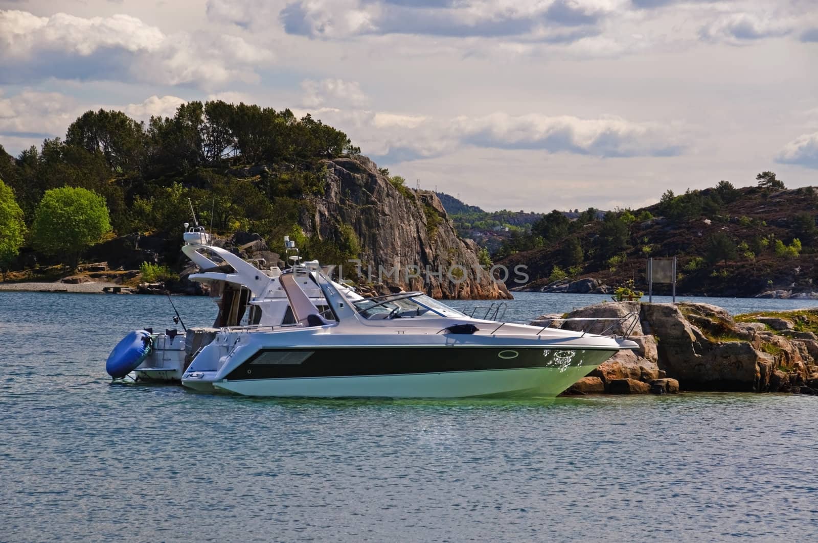 Yacht in the archipelago. The boat is moored to the rocks