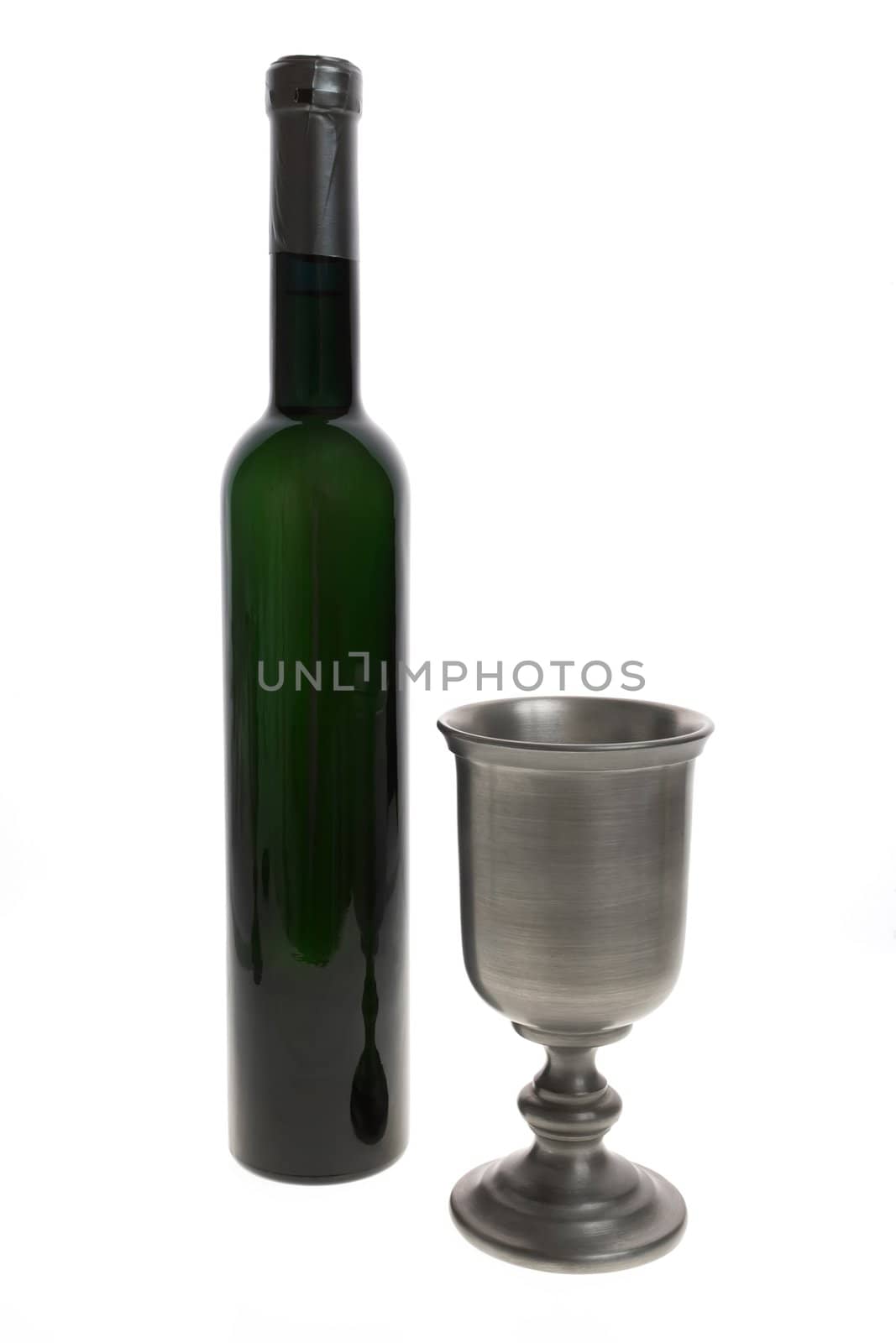 Silver wine goblet and bottle isolated on white background.