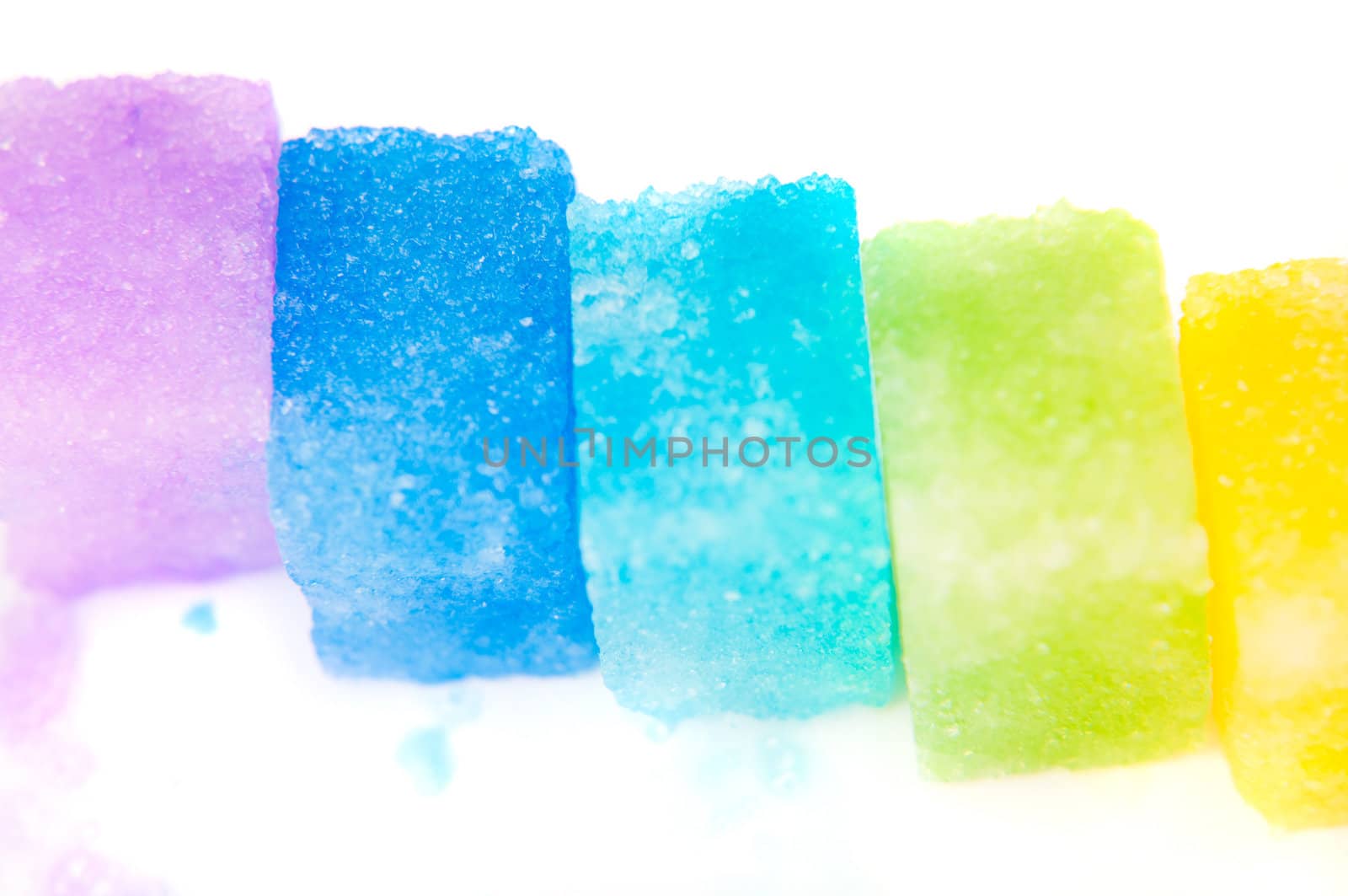 Shot of multicolored slabs of shugar isolated on white