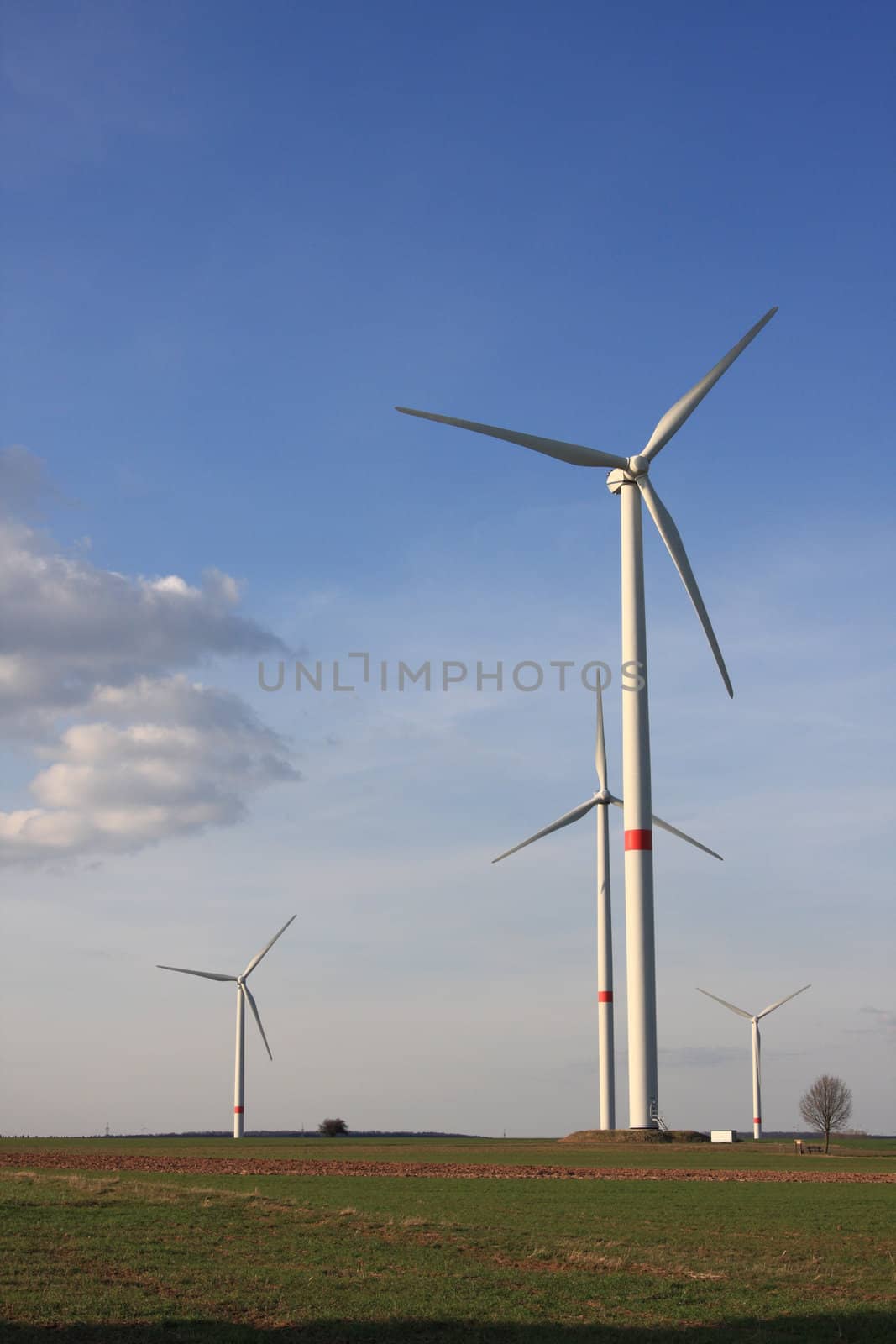 wind turbines under blue sky by derausdo