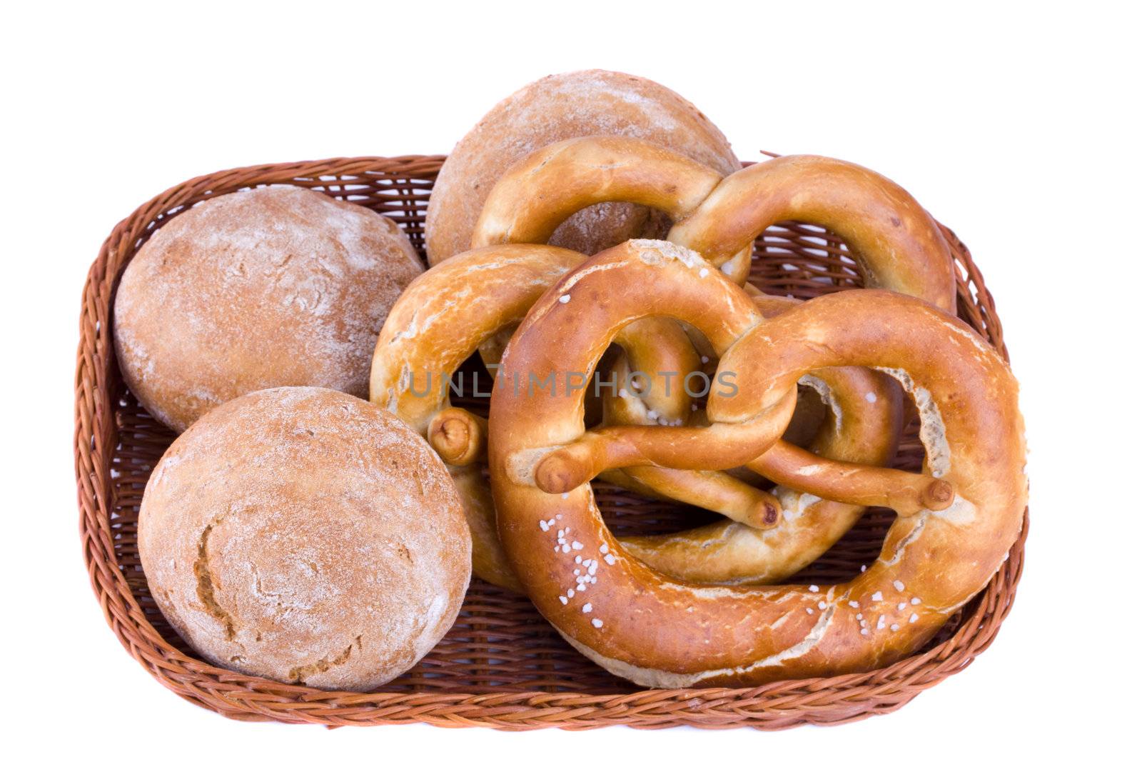 bread basket with pretzel isolated on white by bernjuer