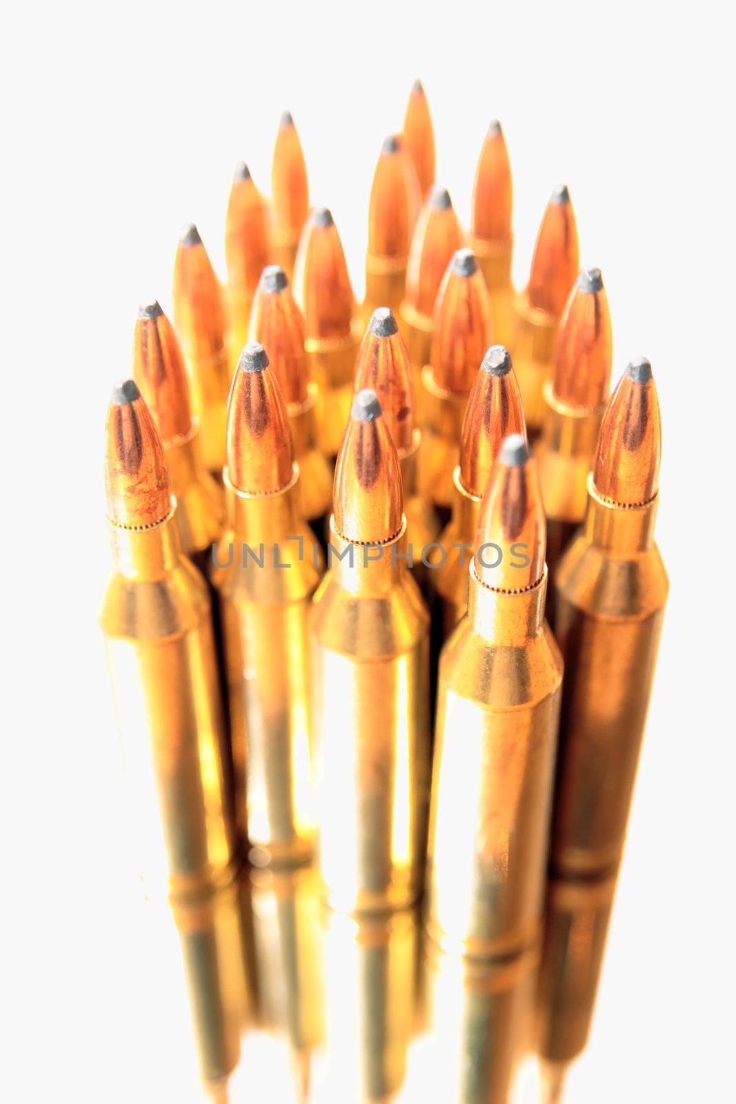 ammunition all in a bunch on a white background