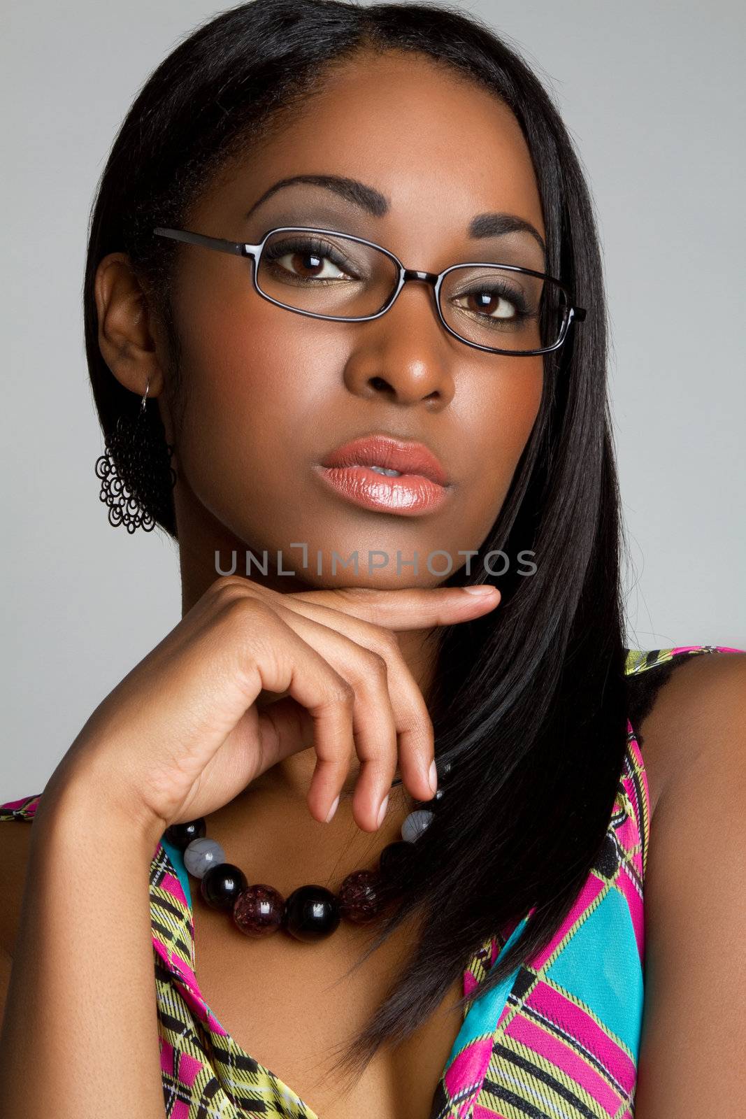 Beautiful thinking woman wearing glasses