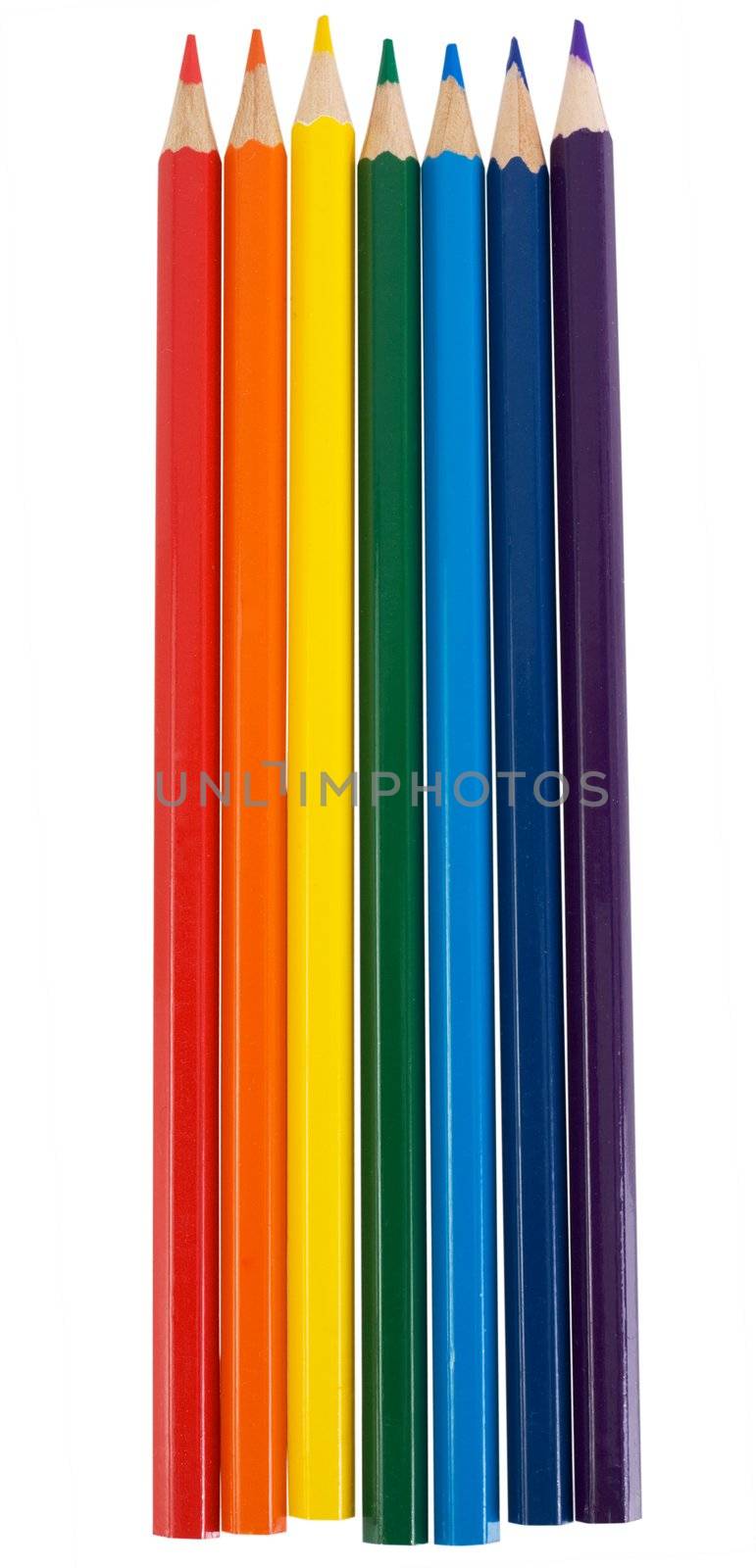 Crayons located on color of the rainbow on the white background