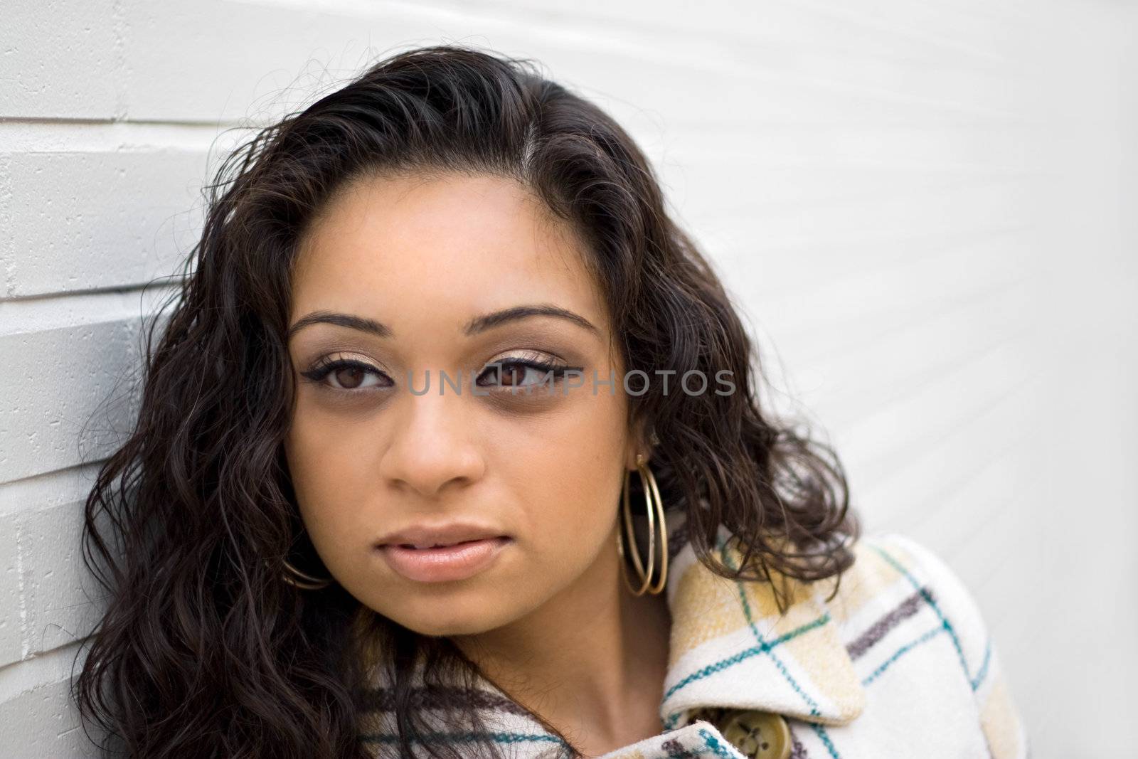 A closeup portrait of an attractive young Indian woman.