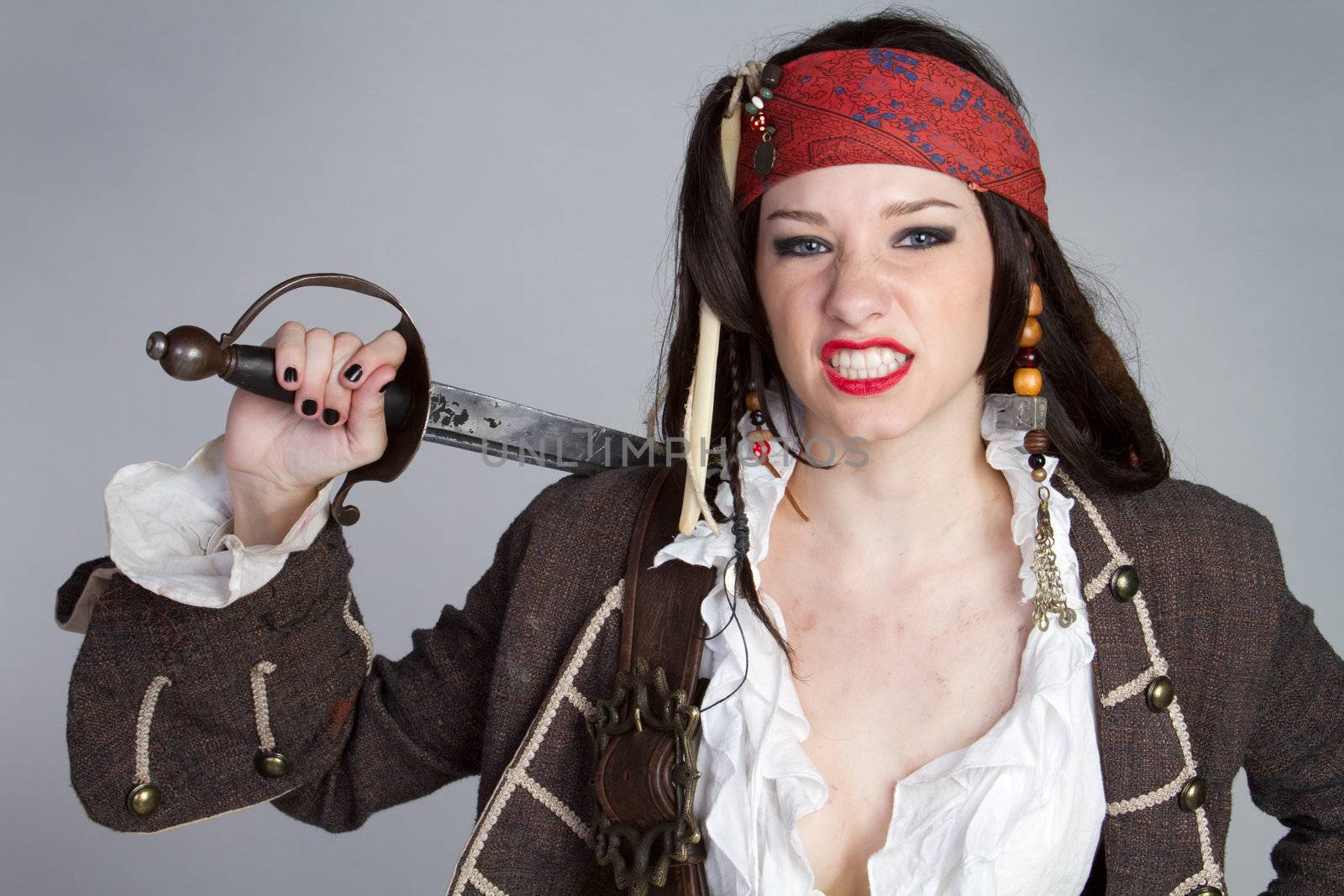 Angry pirate woman holding sword