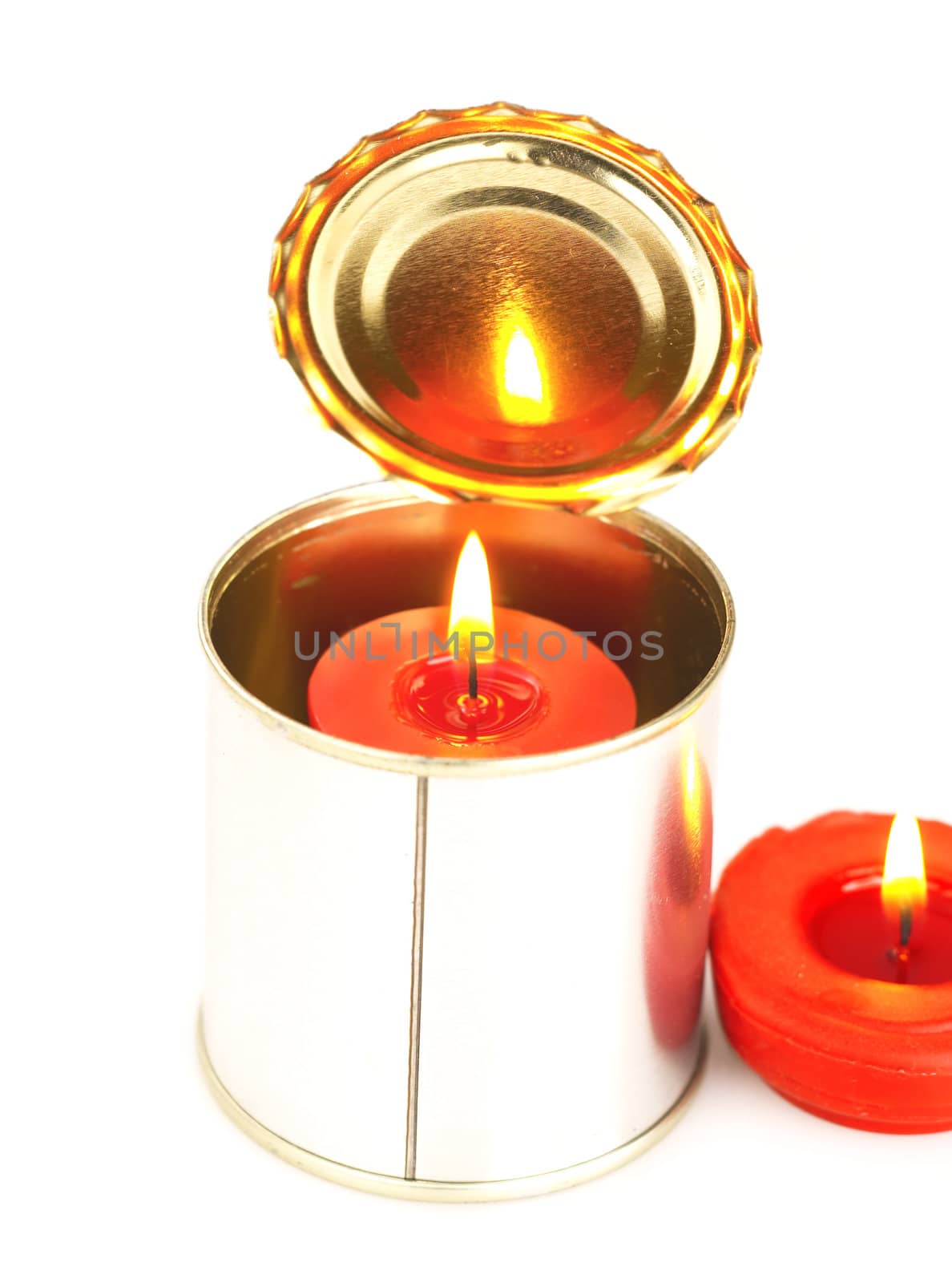 red candle on a tin can ovr white background