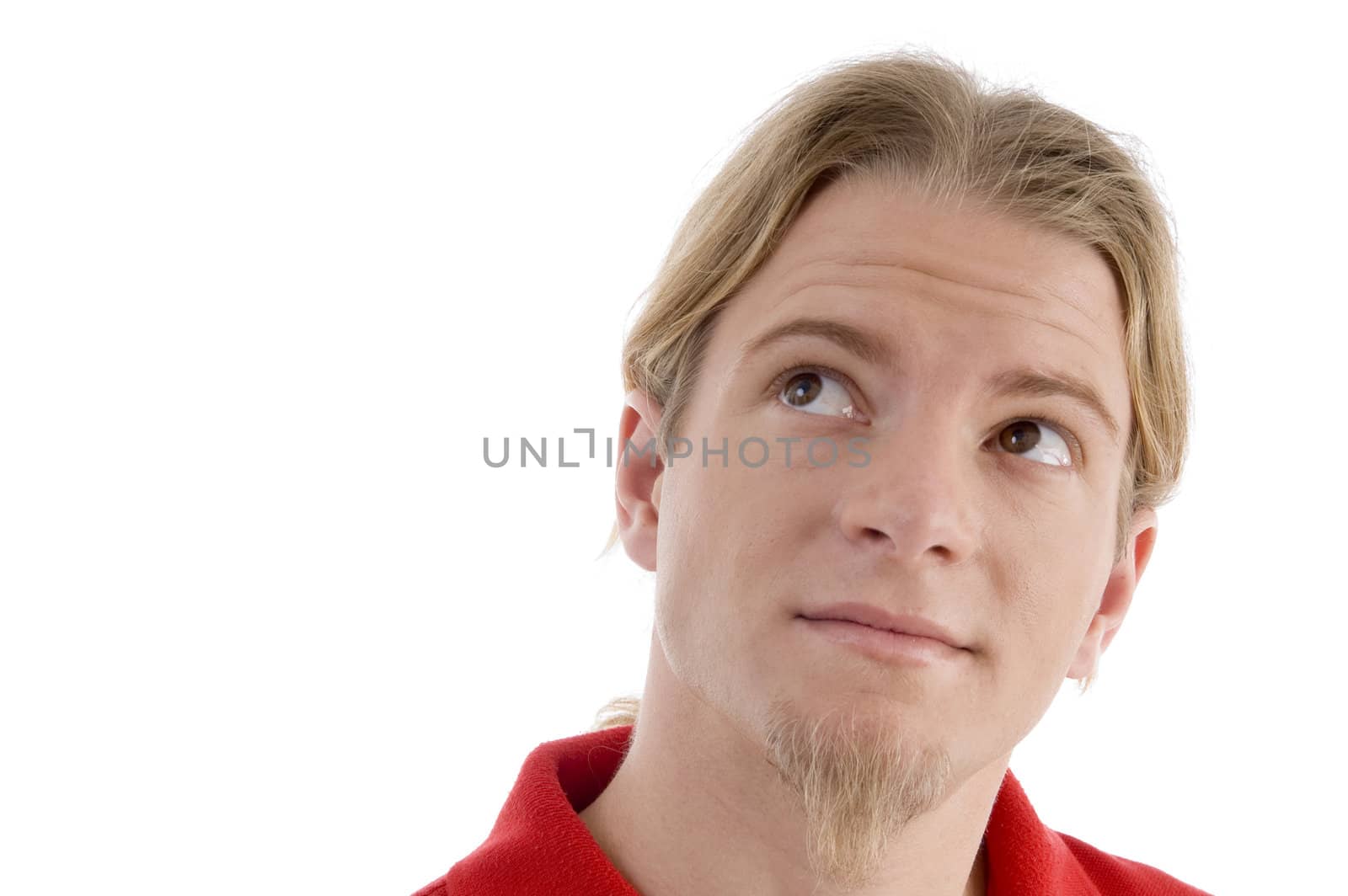 smart young male looking sideways on an isolated background