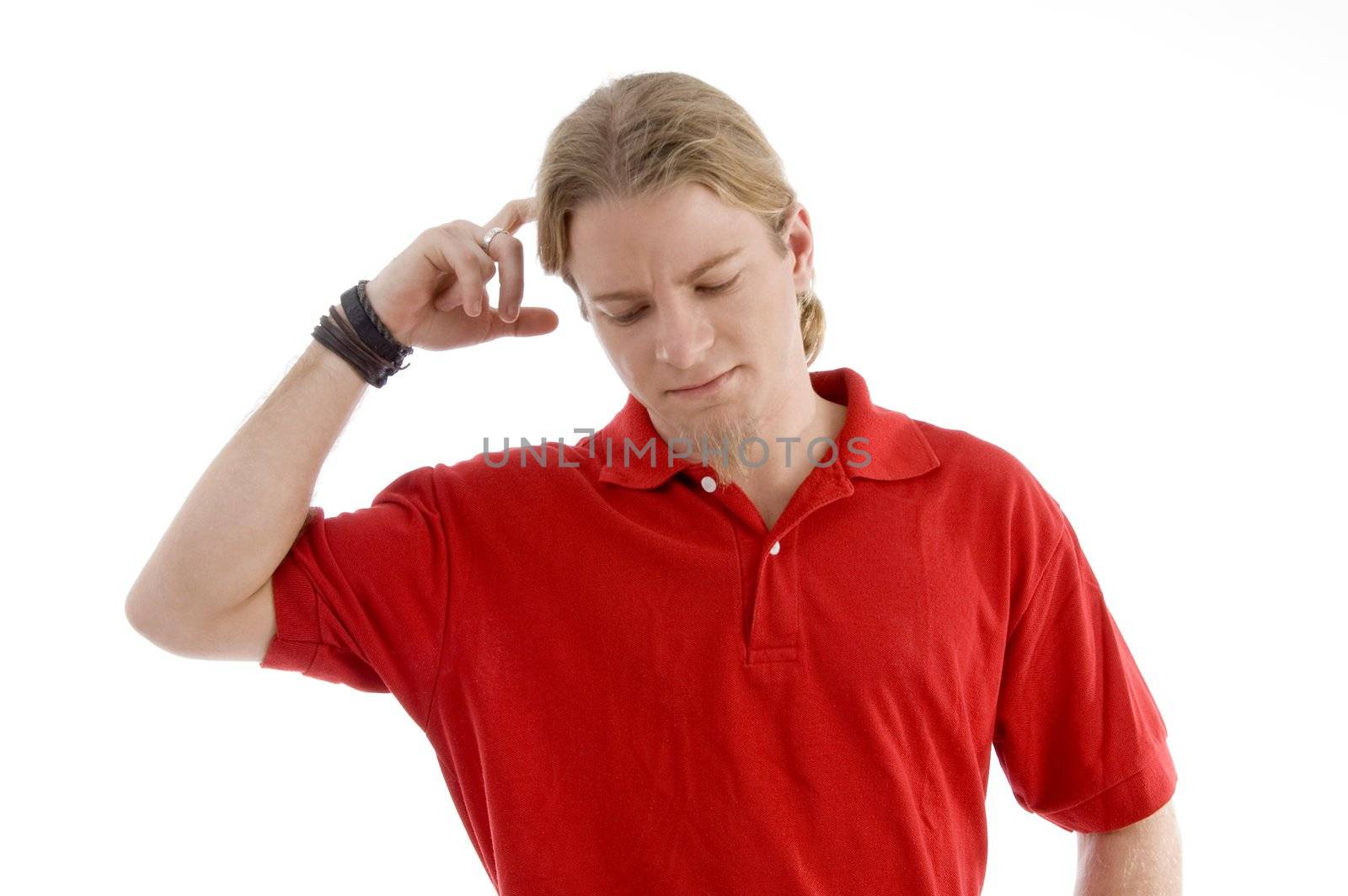 handsome young guy thinking hard against white background