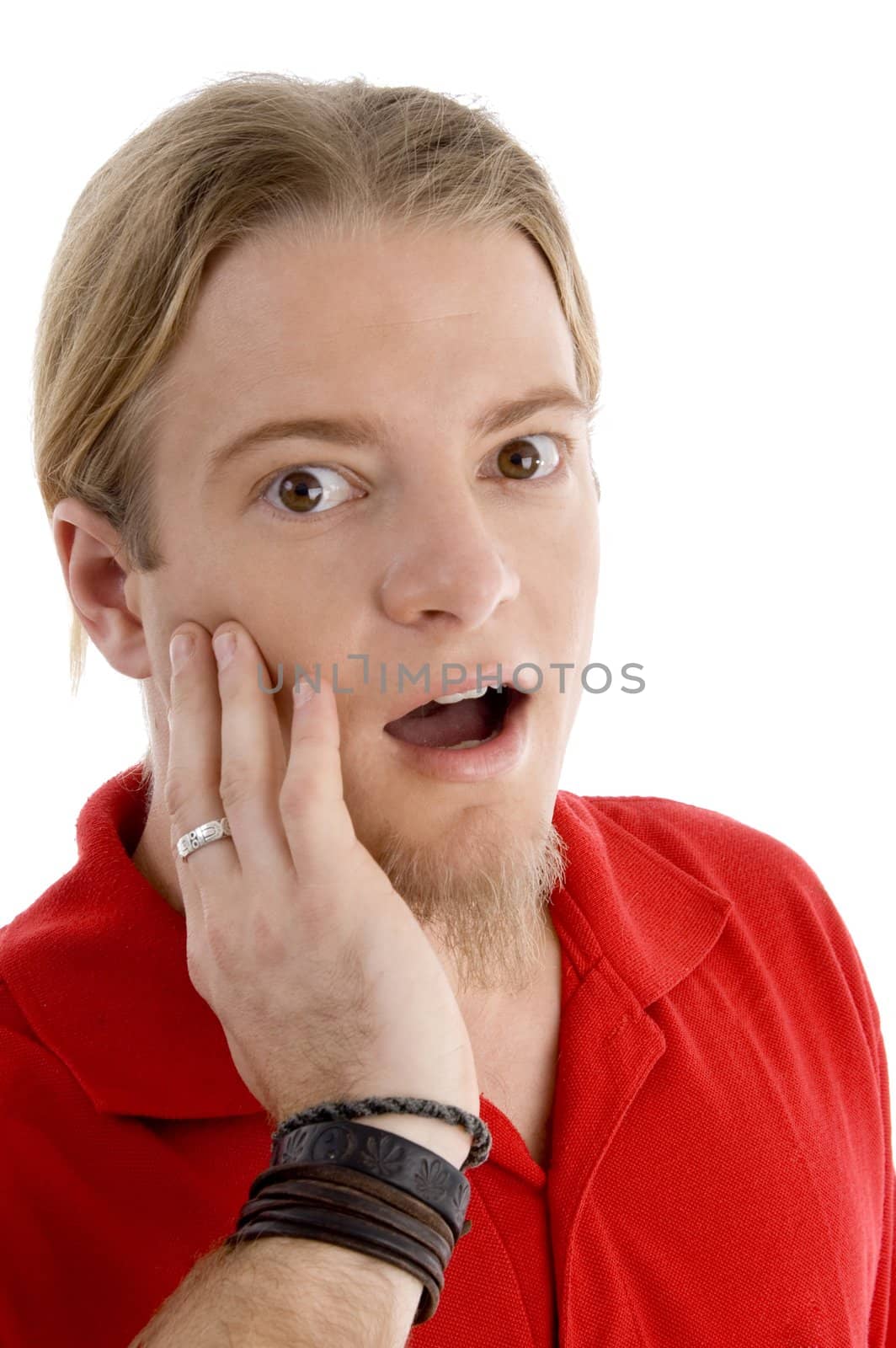 handsome young guy expressing amazement against white background