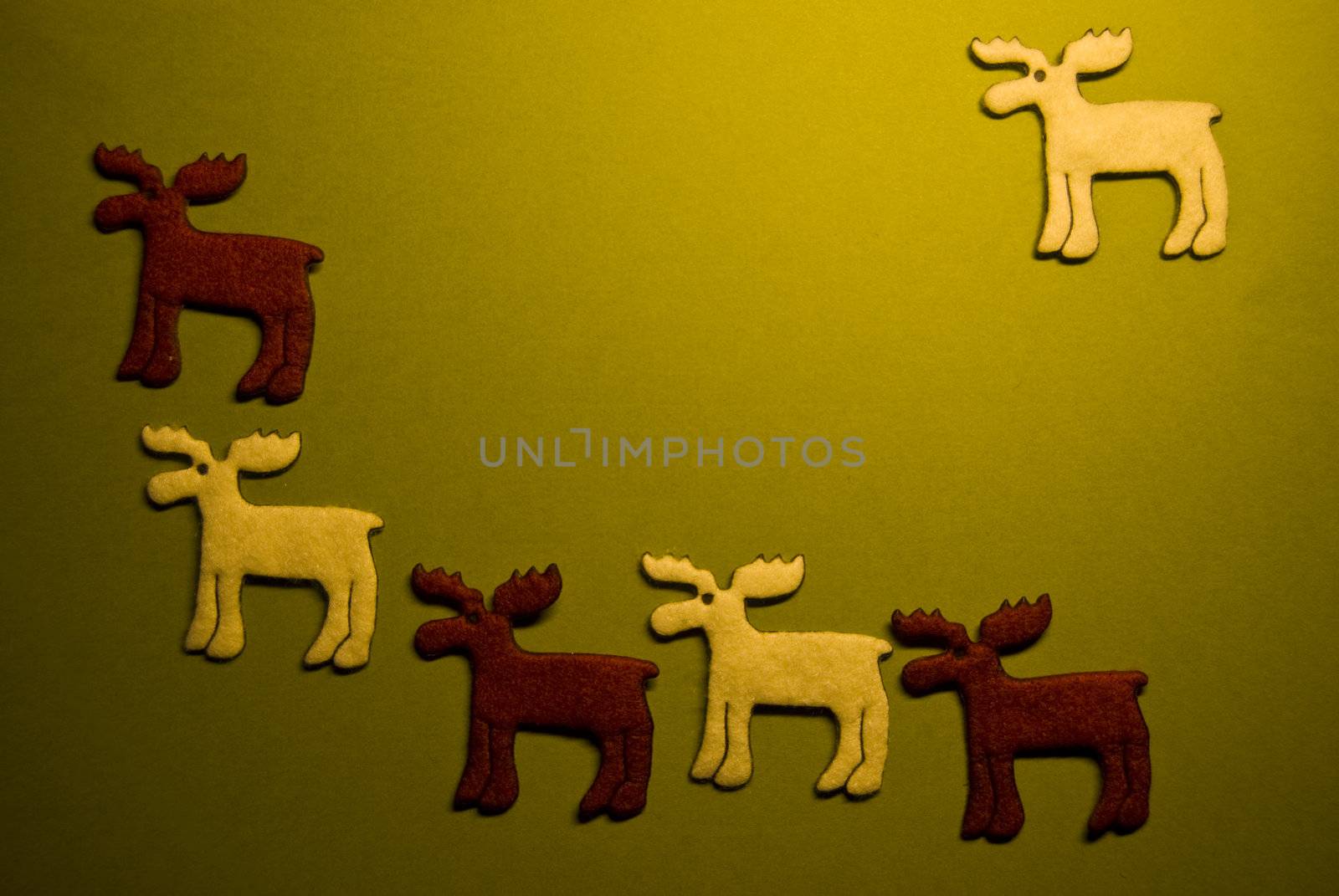 six reindeers on green paper (xmas motif)