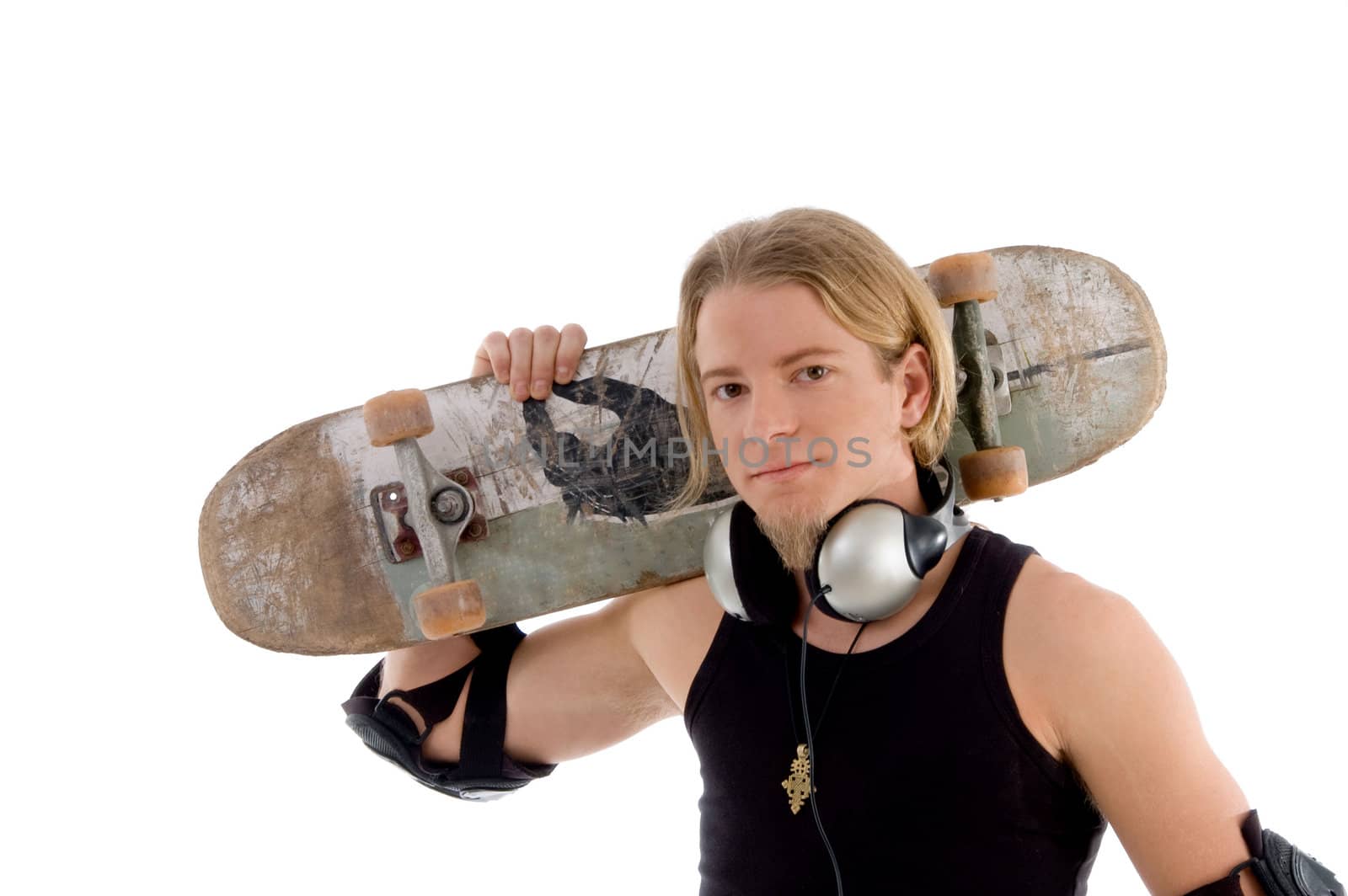 handsome man holding skateboard against white background