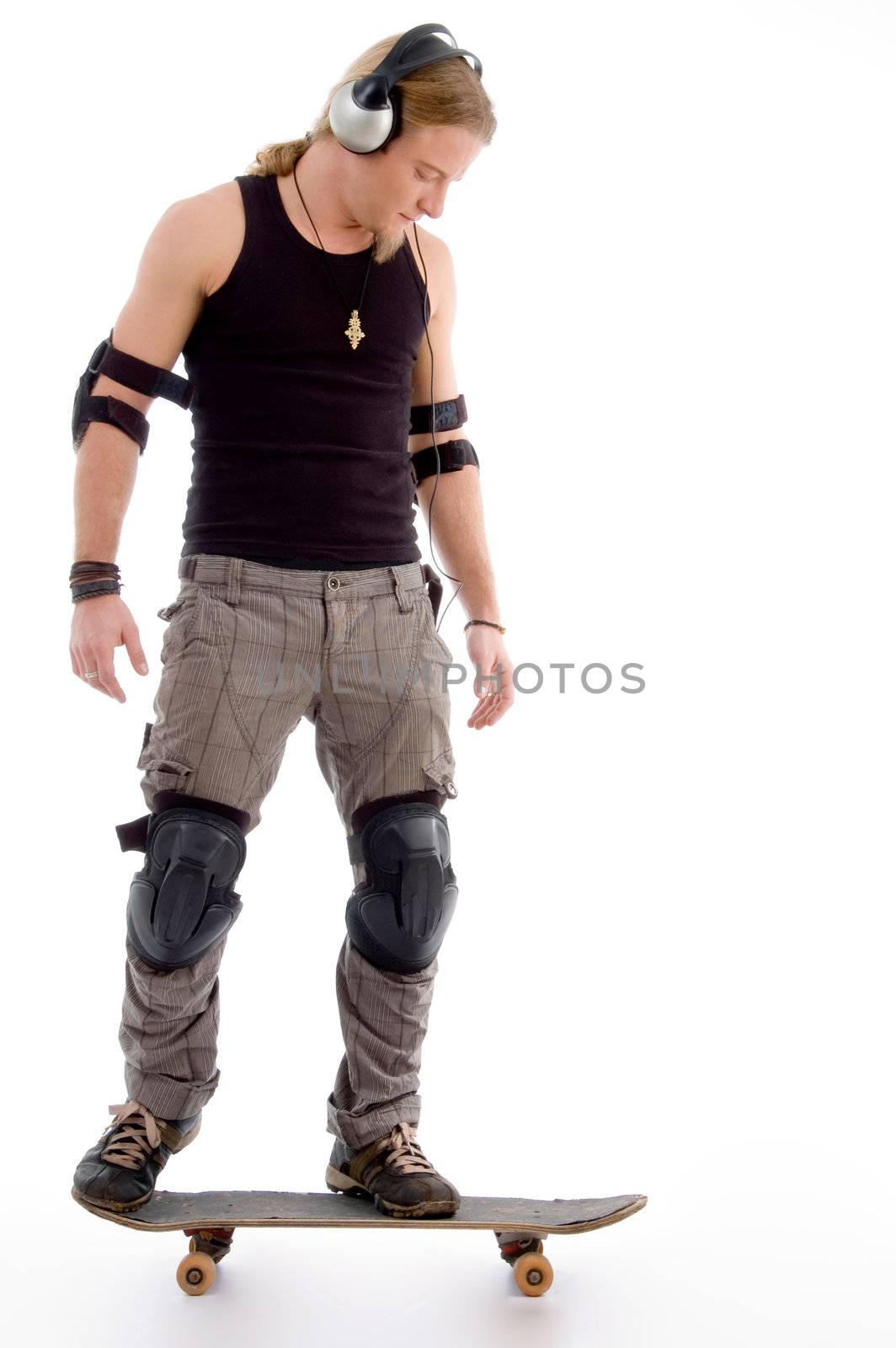 young male model skating on the floor with white background