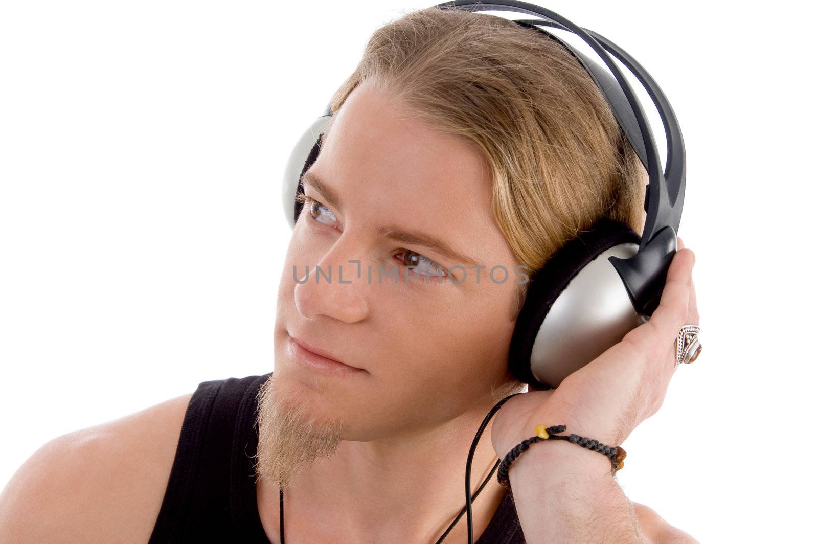 young male busy with headphones on an isolated white background