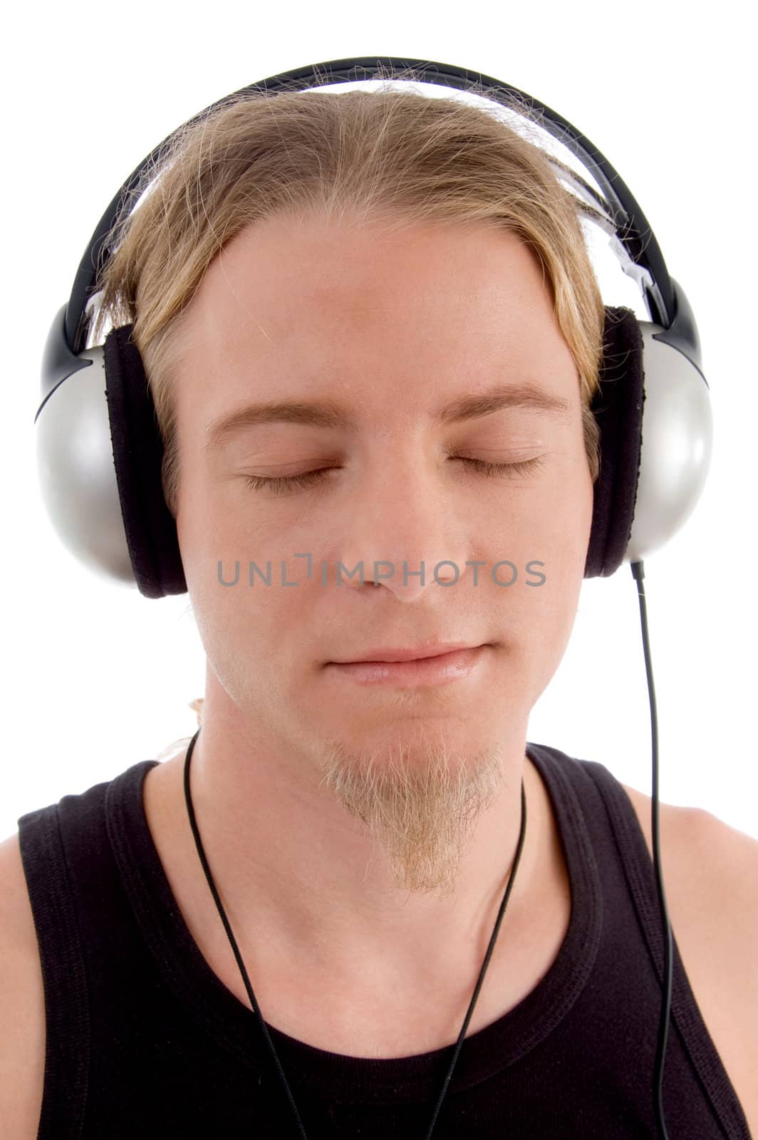 handsome man listening to music with white background