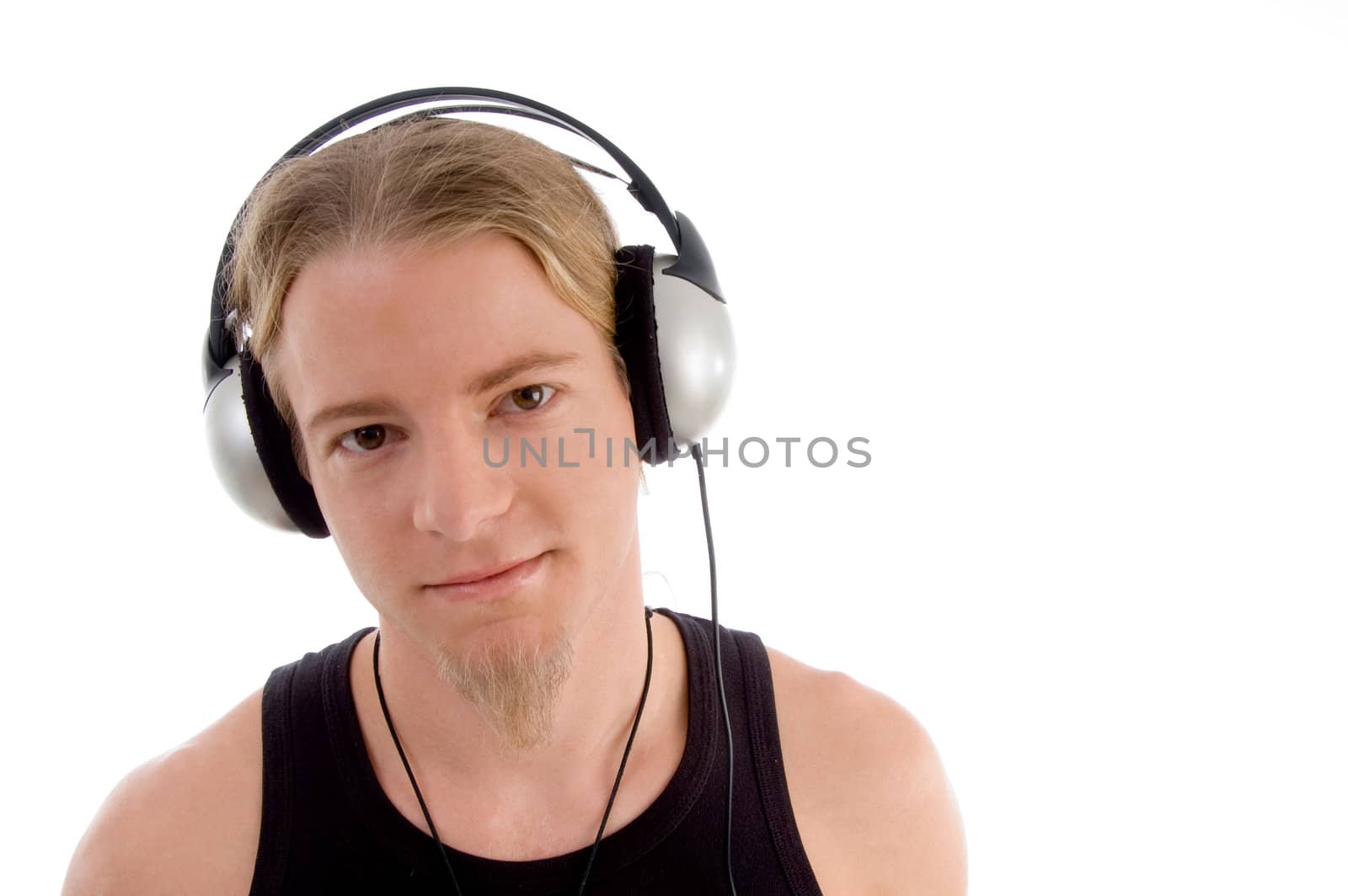 handsome man listening to music with white background