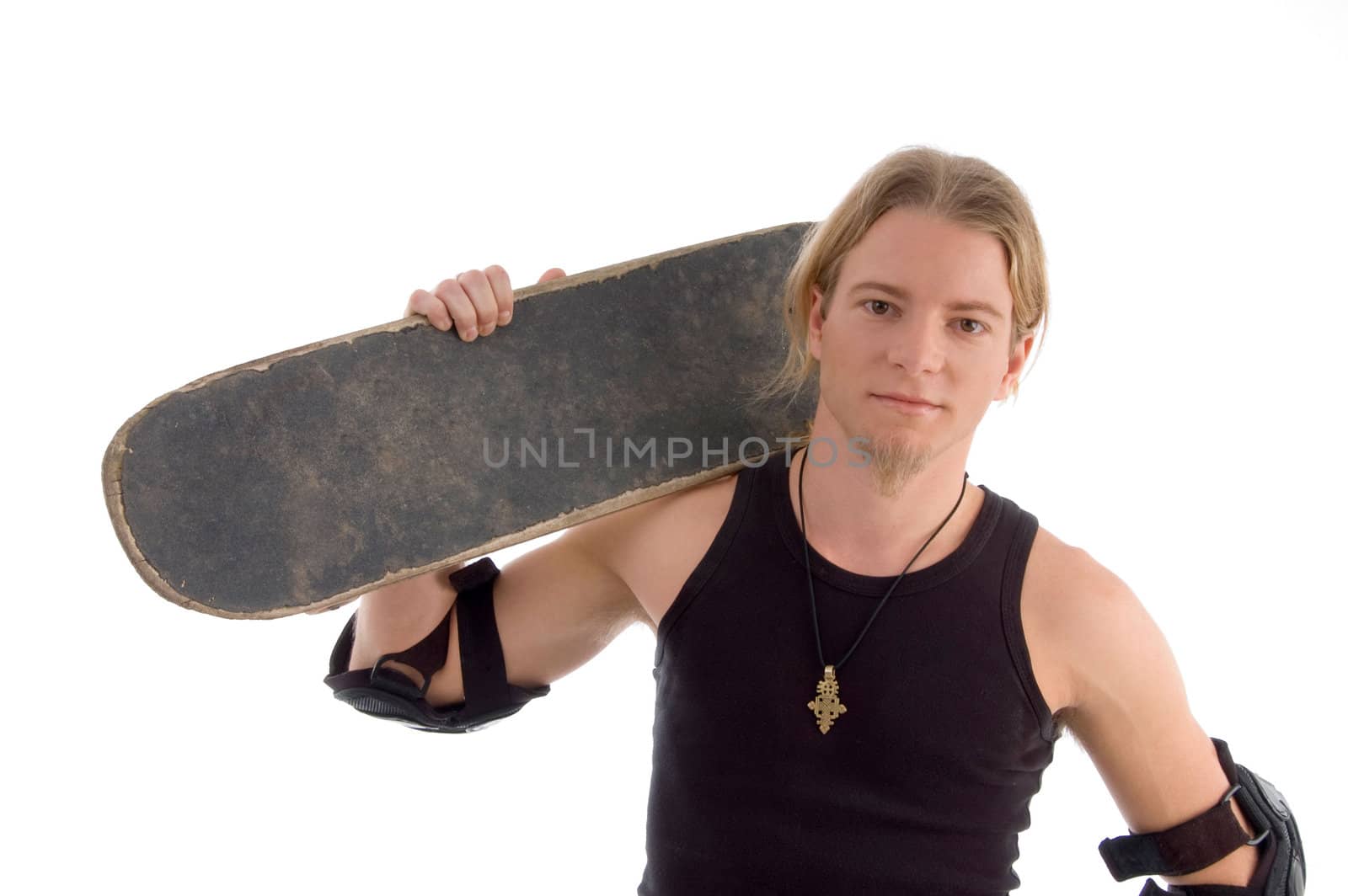 handsome guy holding skateboard on his shoulder on an isolated white background