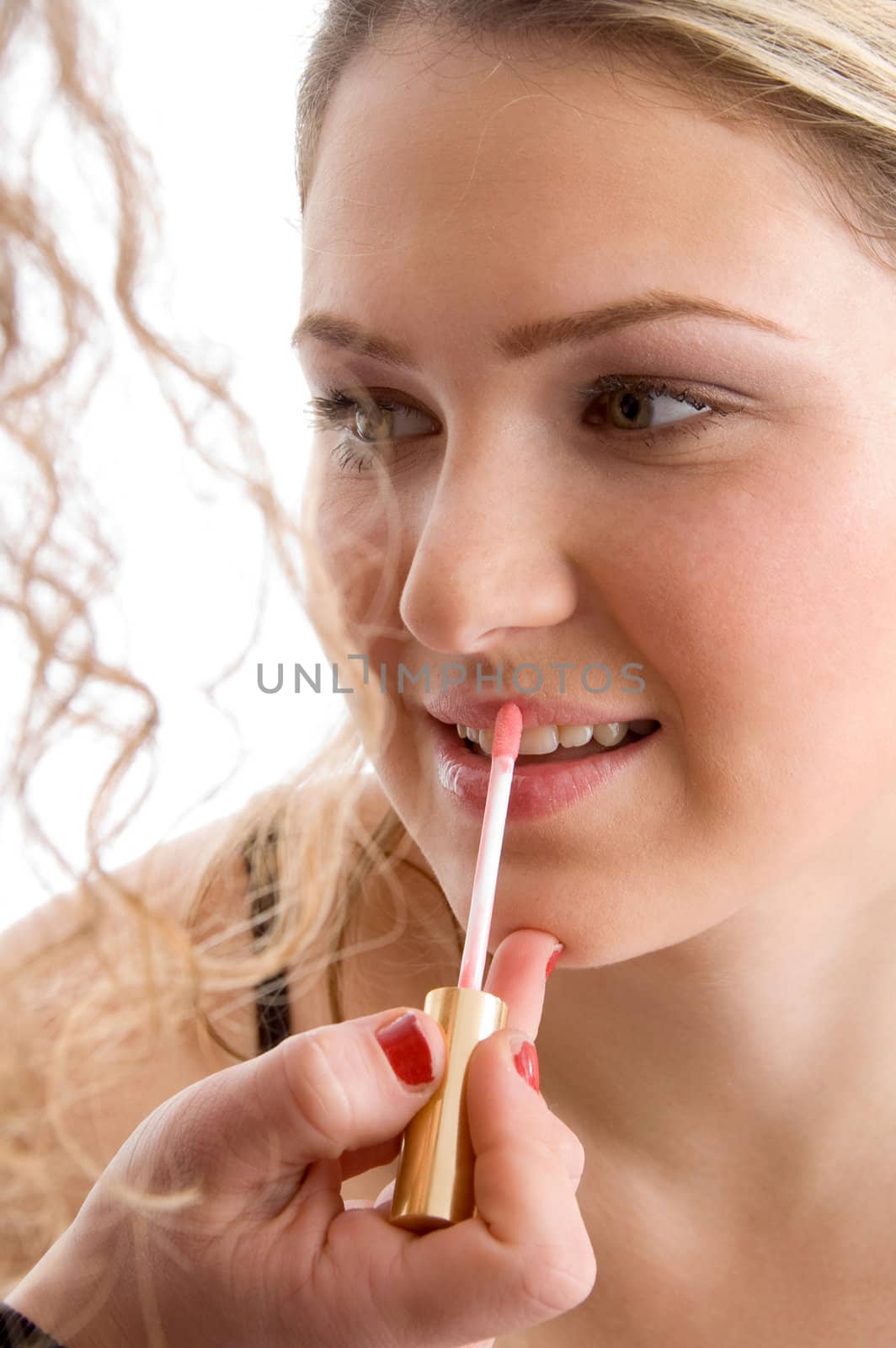 pretty model getting lip makeup on an isolated white background