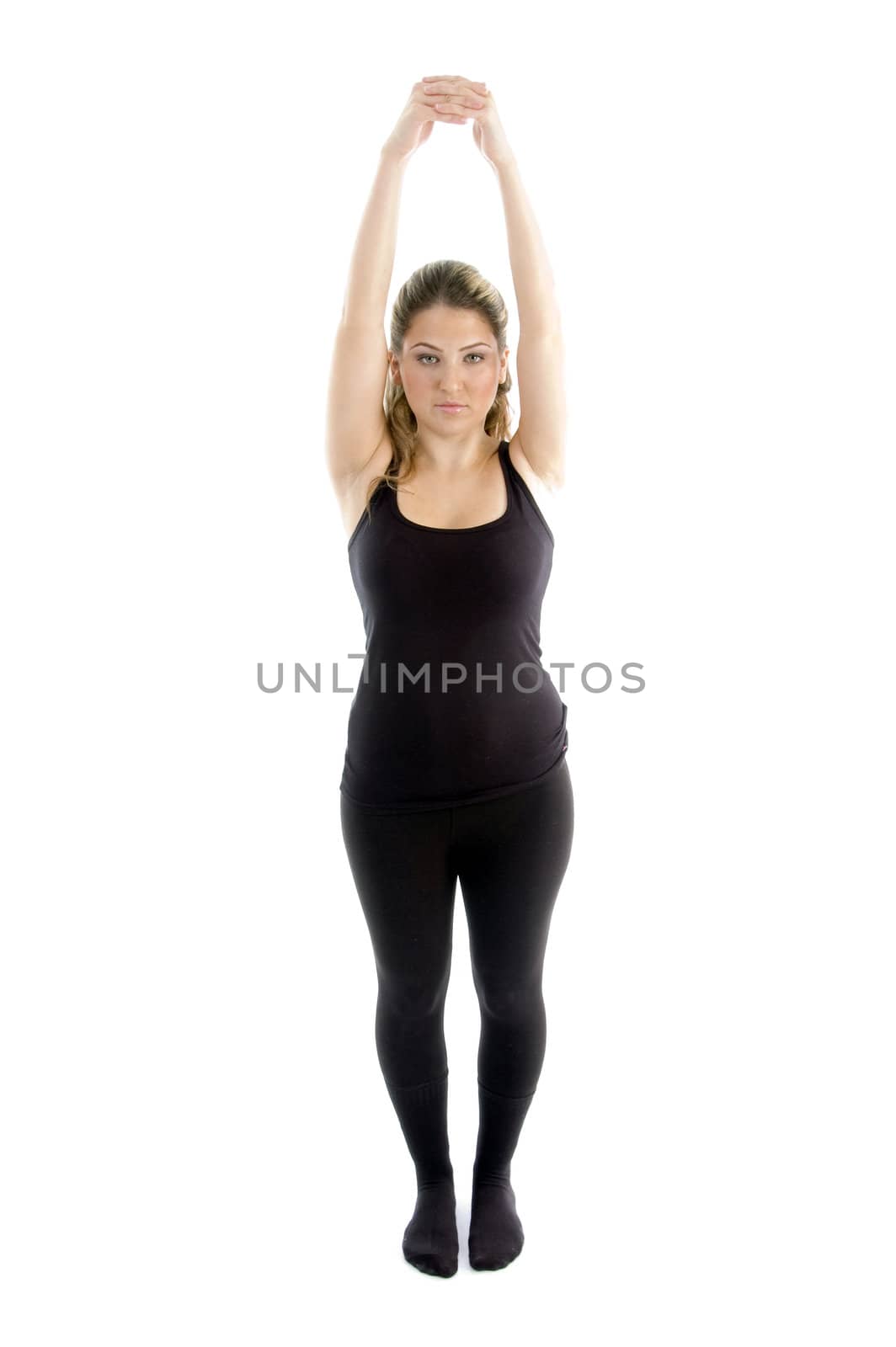 young girl stretching her arms on an isolated background