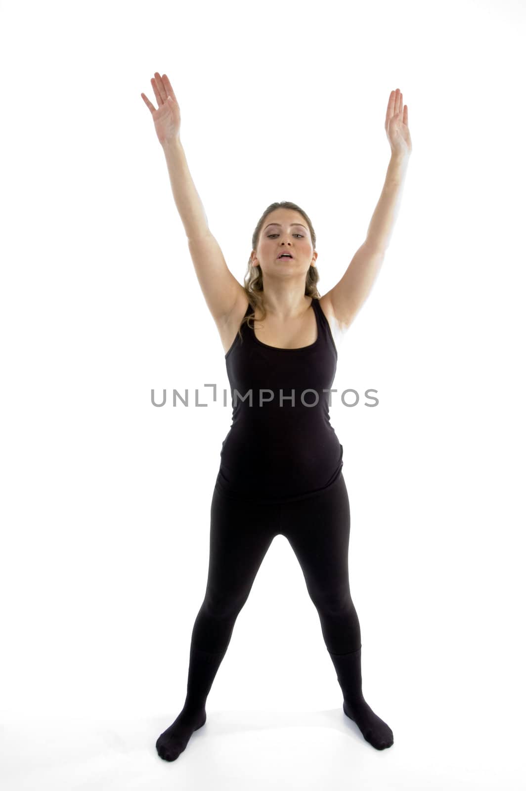 standing girl stretching her arms on an isolated background