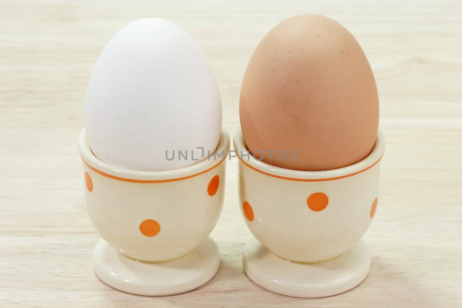 White and brown egg in eggcups