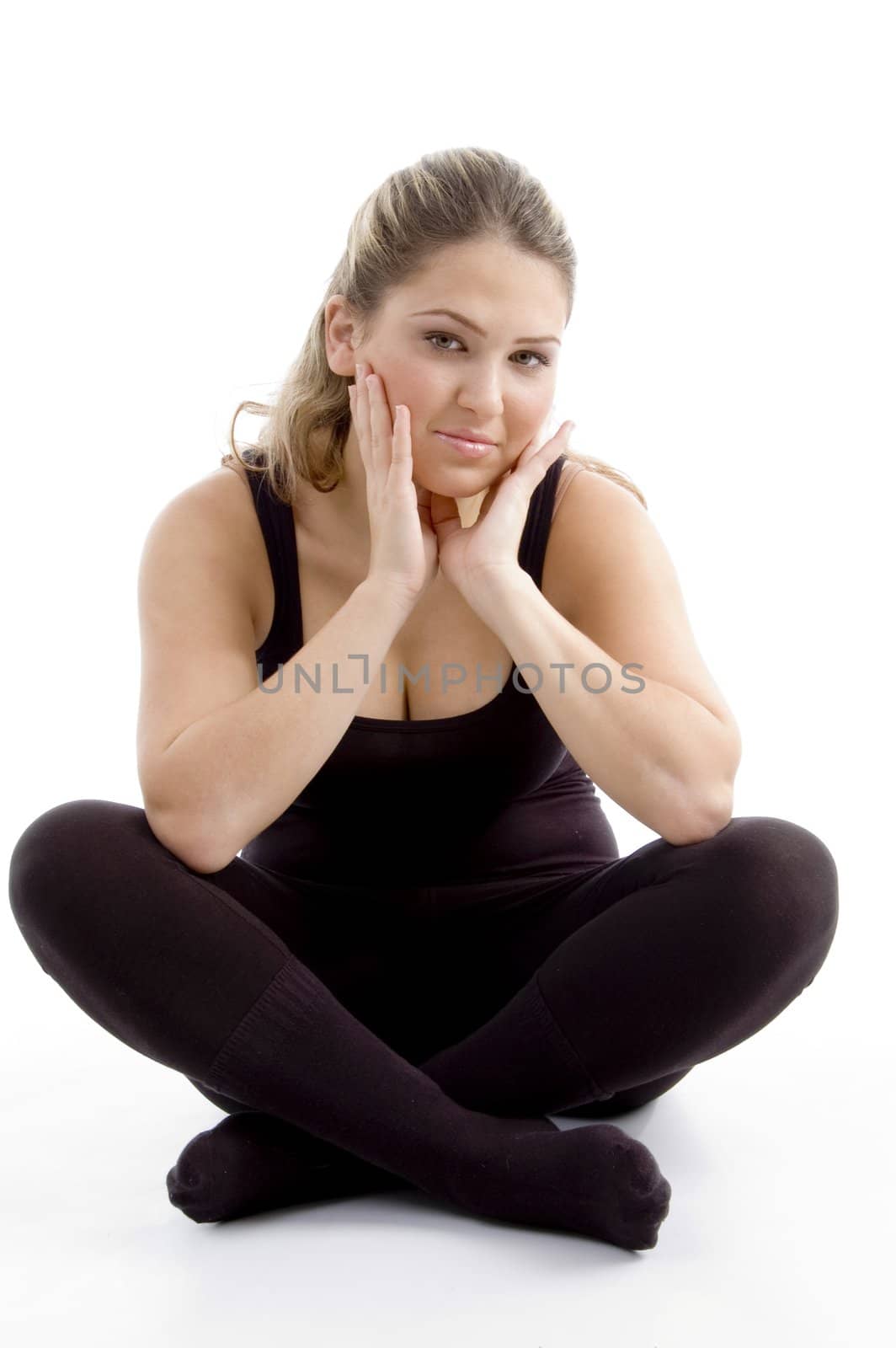 sitting girl looking at camera against white background