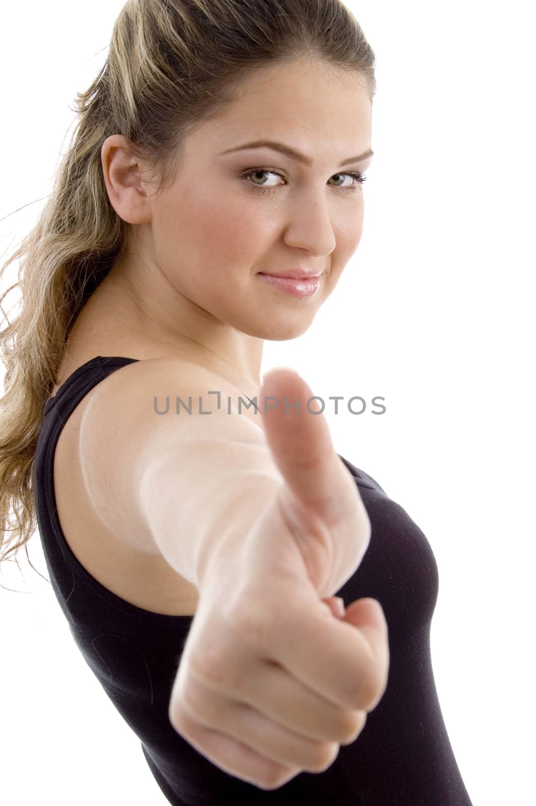 side view of smiling girl showing thumb up on an isolated background