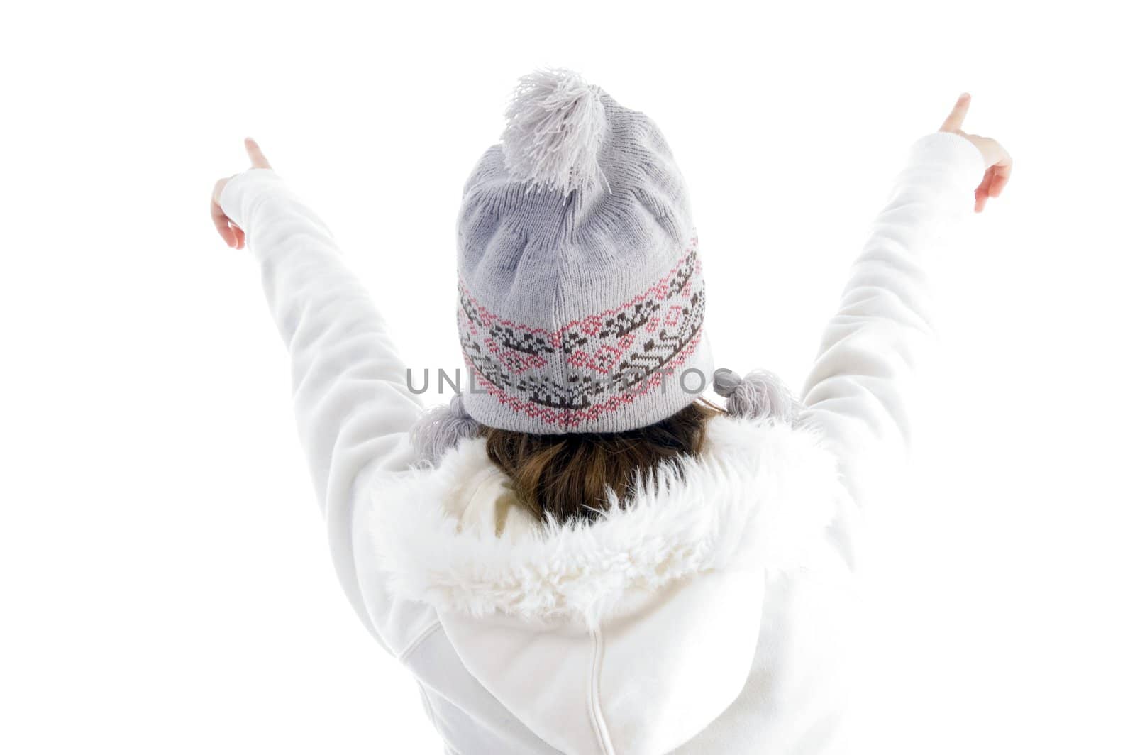 girl pointing with both hands against white background