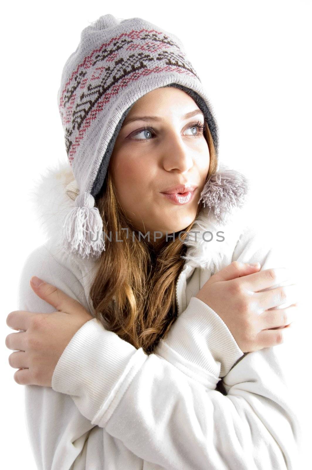 beautiful young female shivering in cold on an isolated background