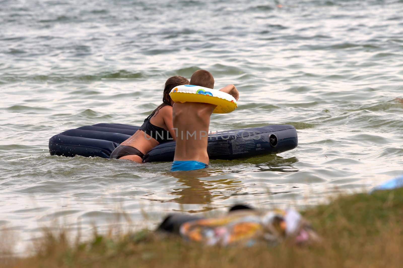 children on lake