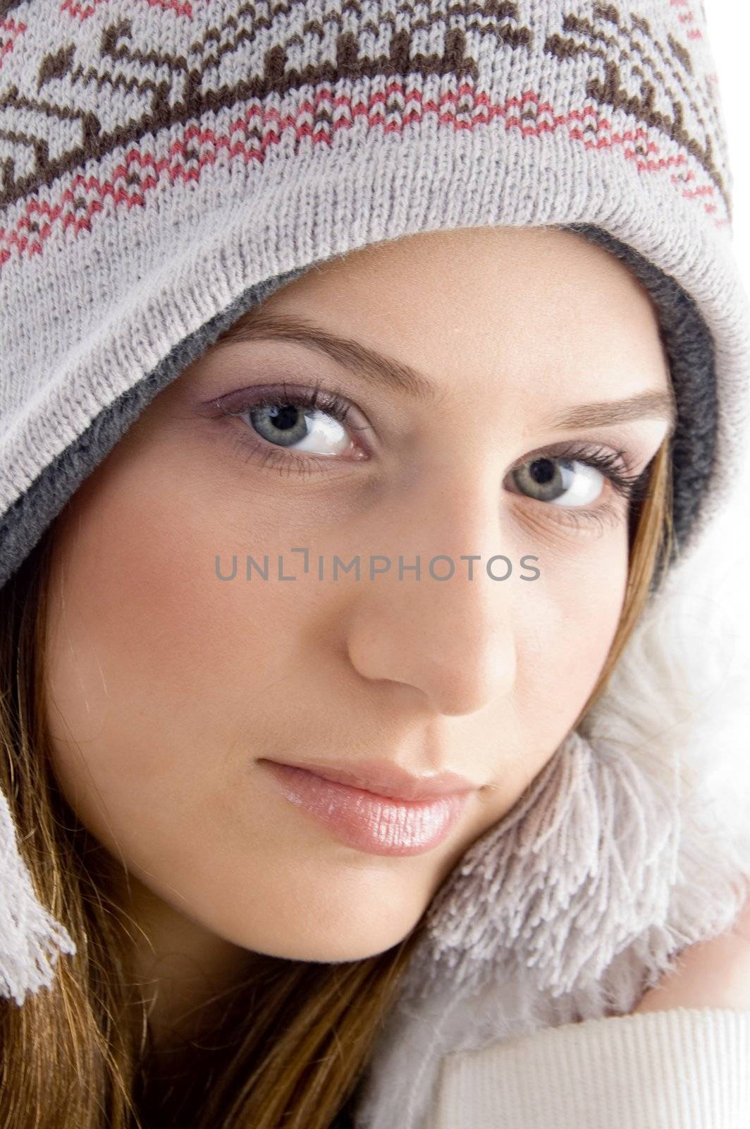 attractive face of female wearing cap with white background