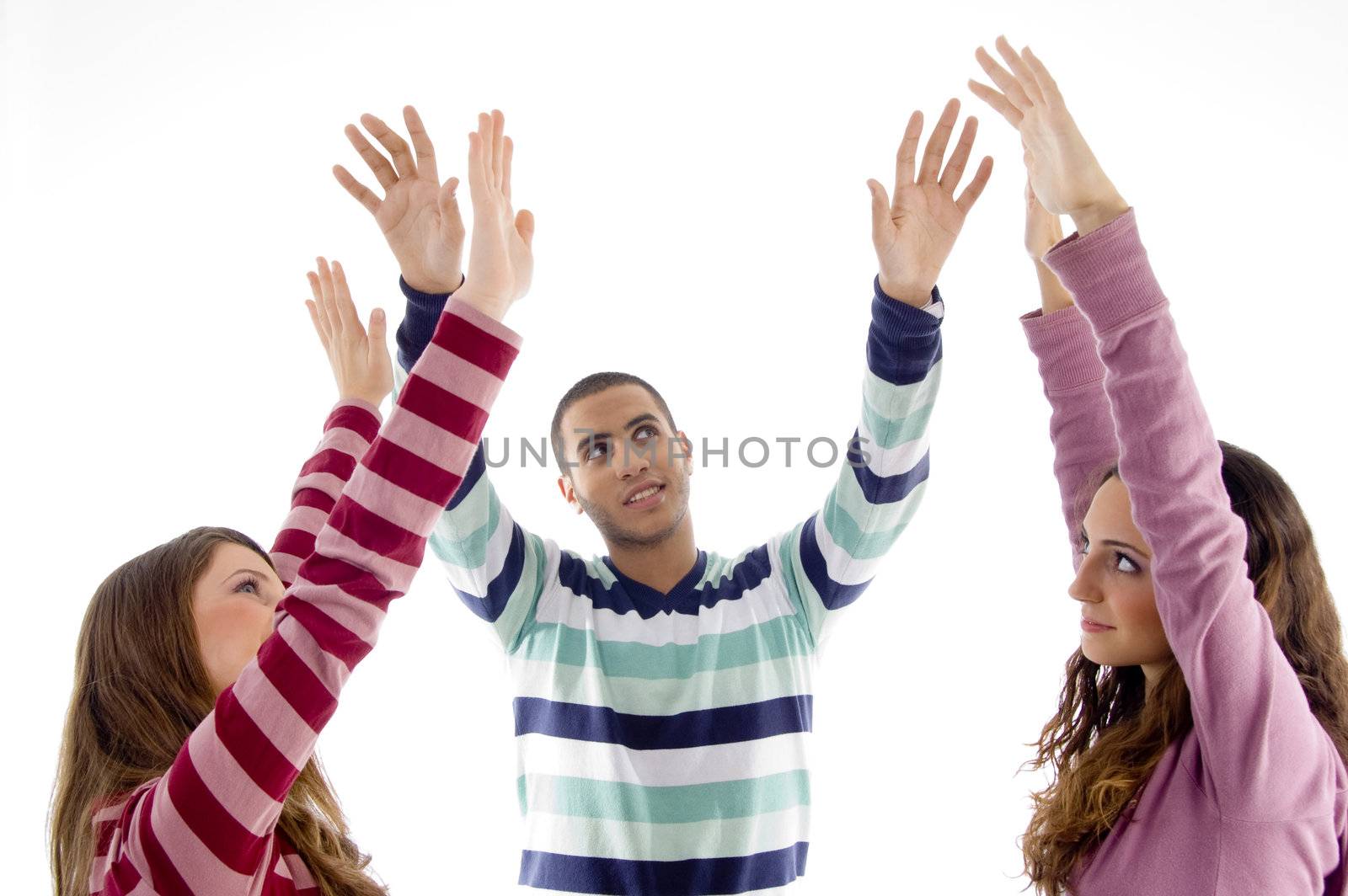 portrait of friends with raised arms with white background