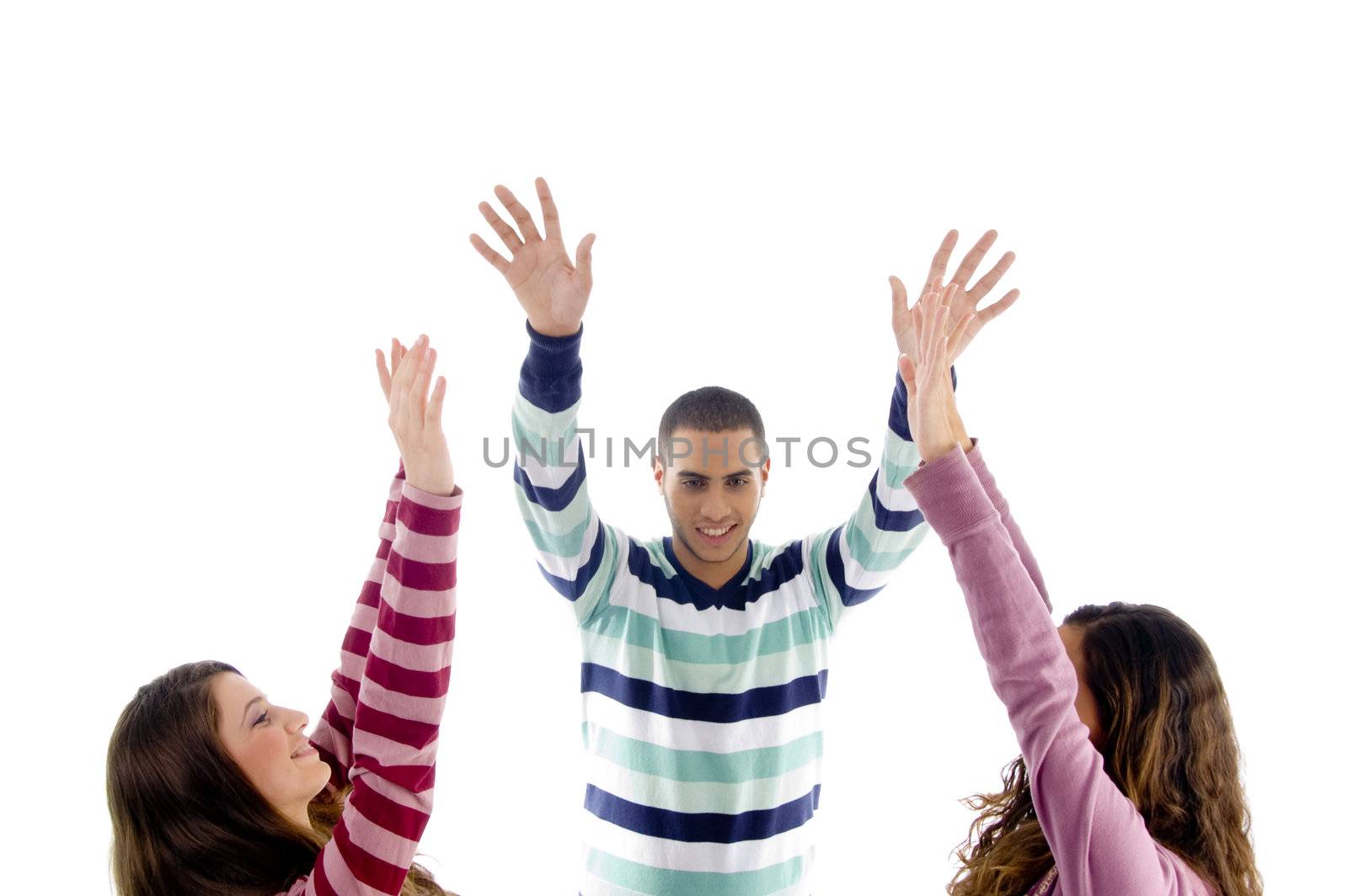 young friends with raised arms on an isolated white background