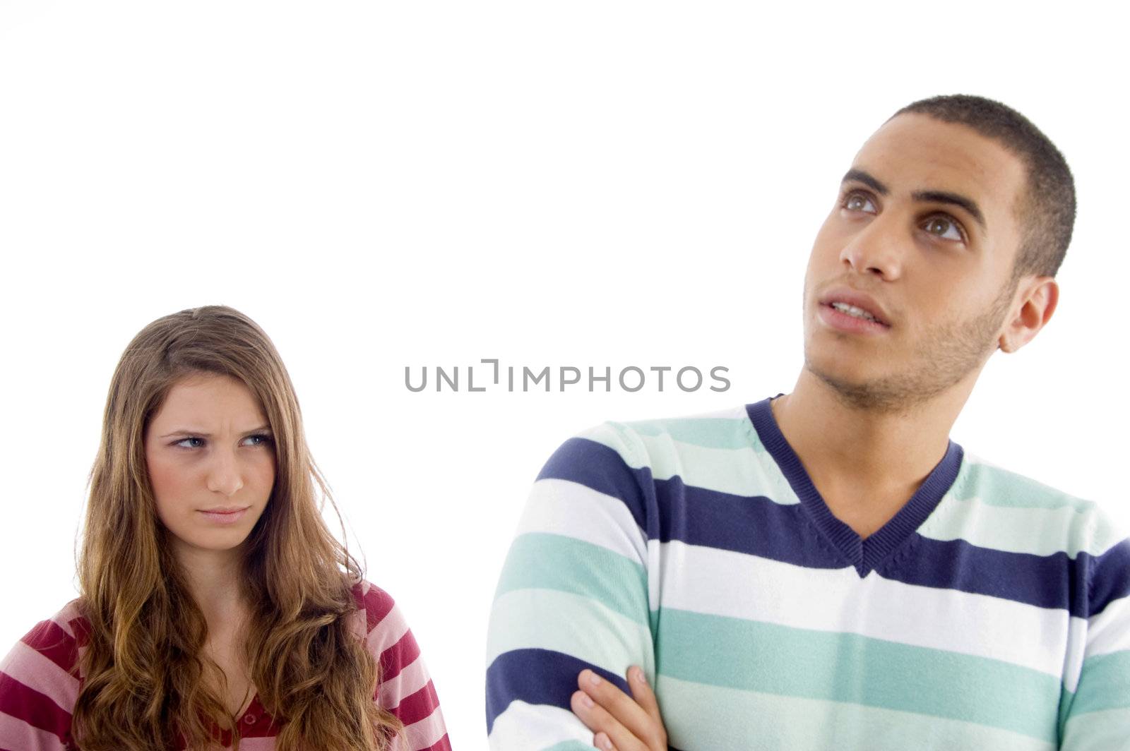 angered young girl looking to guy on an isolated white background
