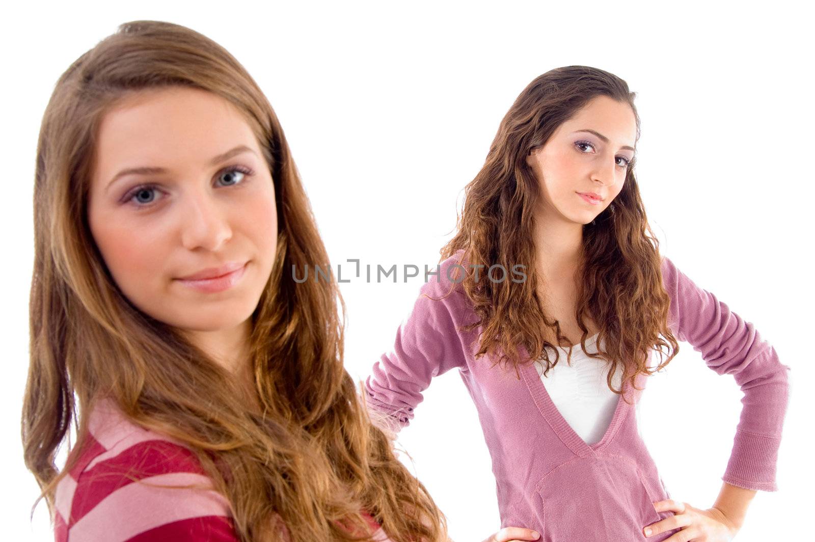 beautiful girls standing in front of camera against white background