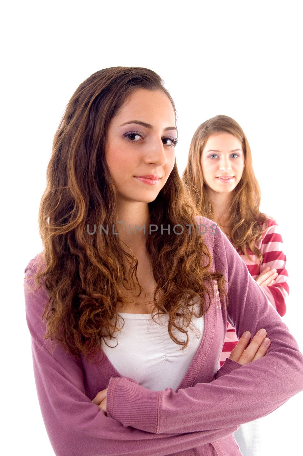 young one girl standing near to camera and another back of her against white background