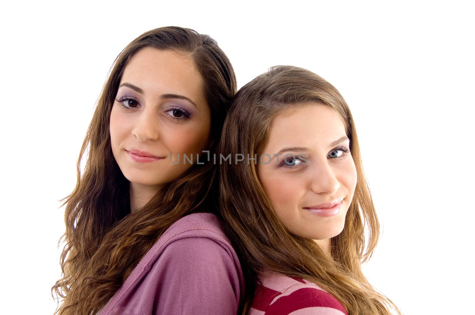 close up view of teens friends smiling and looking at camera against white background