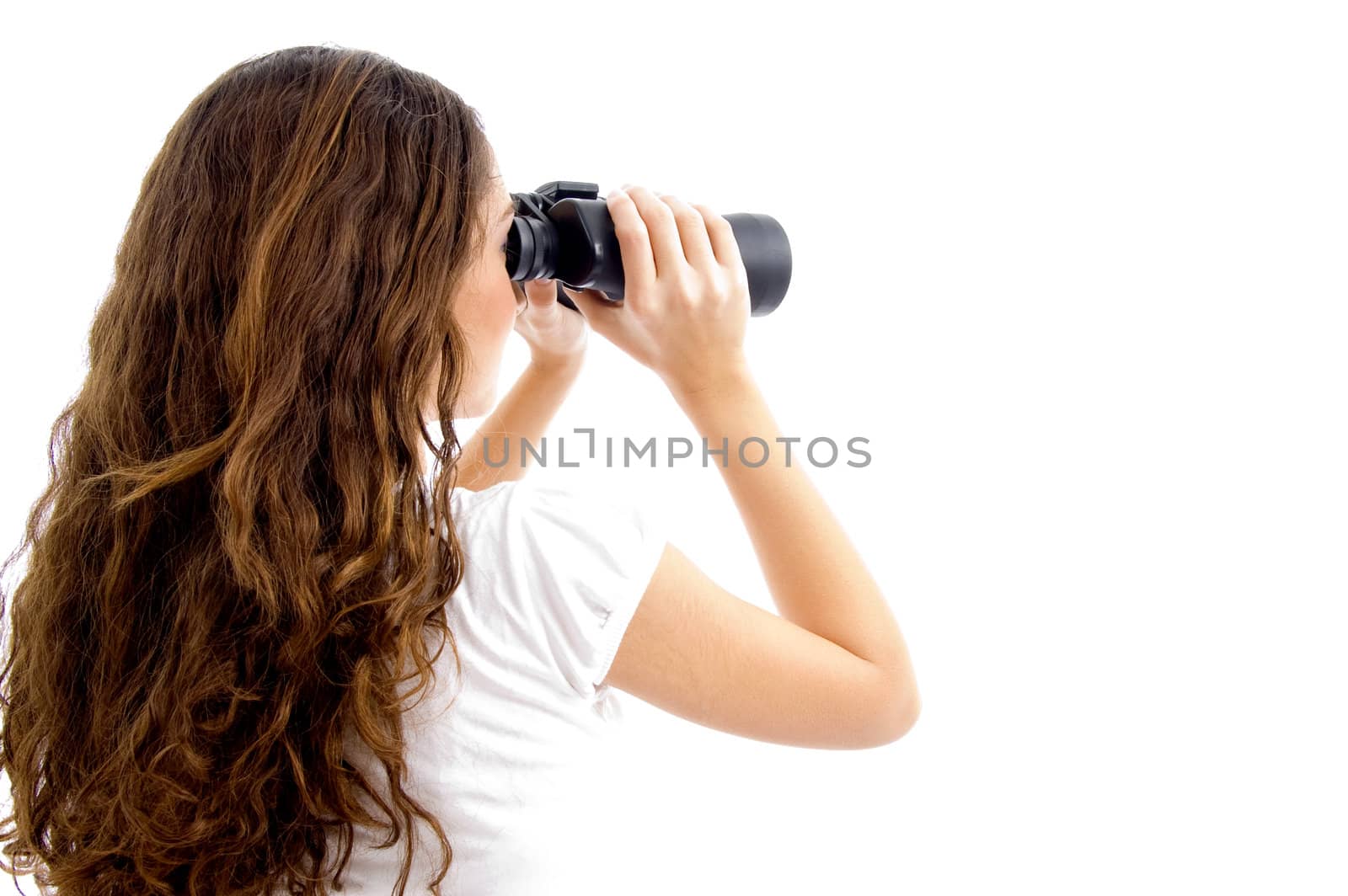 teenager girl watching through binocular on an isolated background