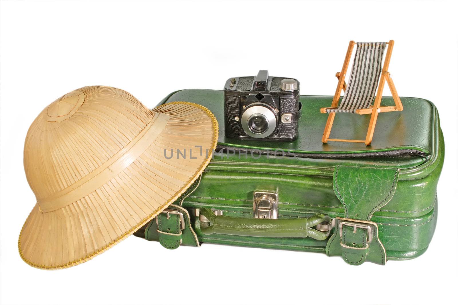 Suitcase with safari hat, old camera and little deck chair - isolated on white background