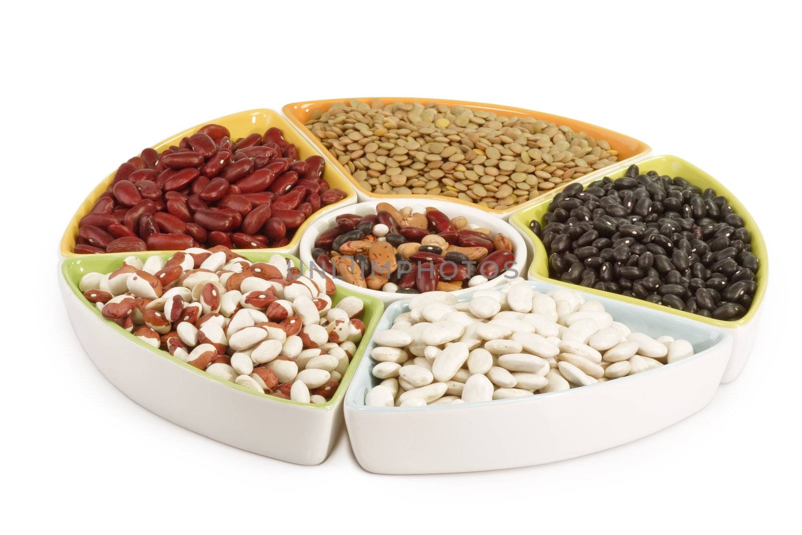 Colorful mix of dried legumes on white background