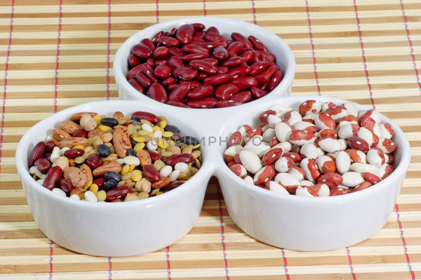 Mixed colorful beans in a white bowl