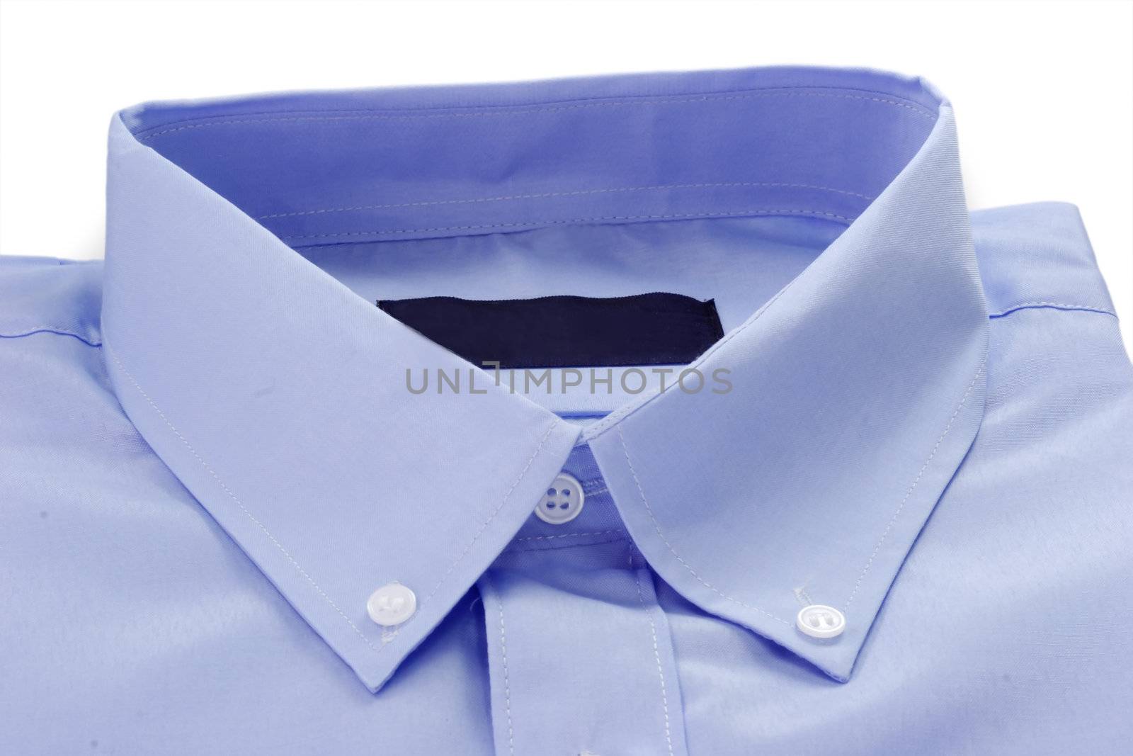 Detail of blue shirt with collar and buttons.
