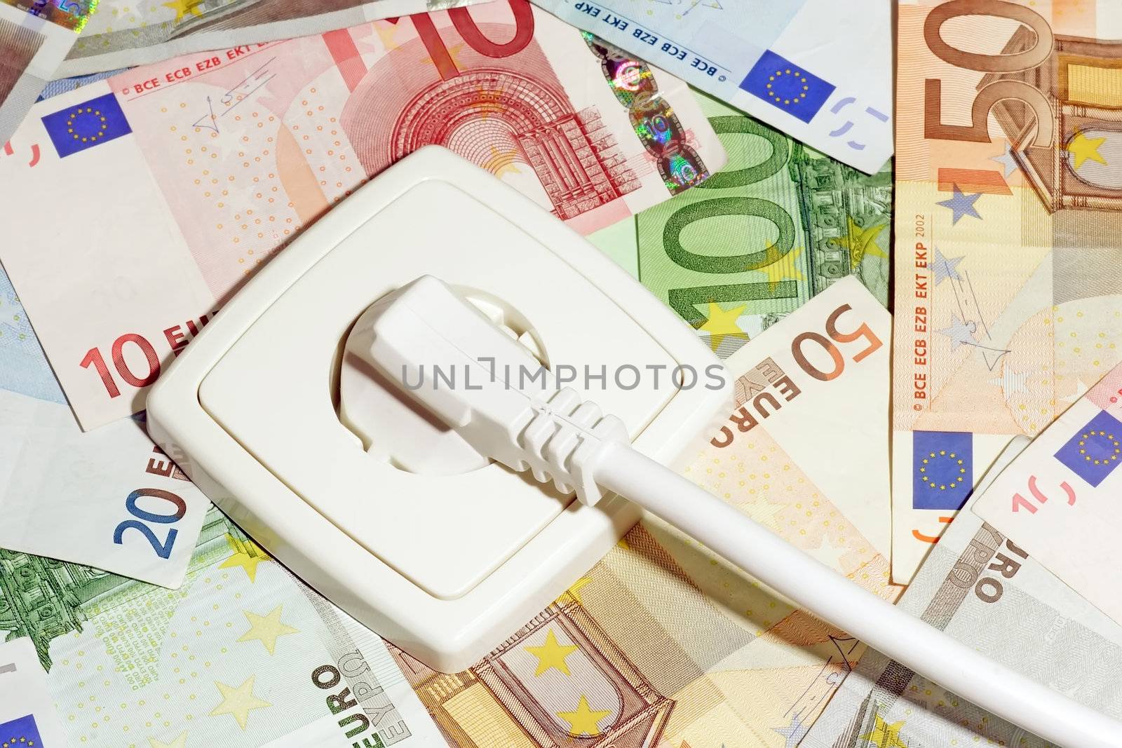 Plugged power cable isolated on a money background.
