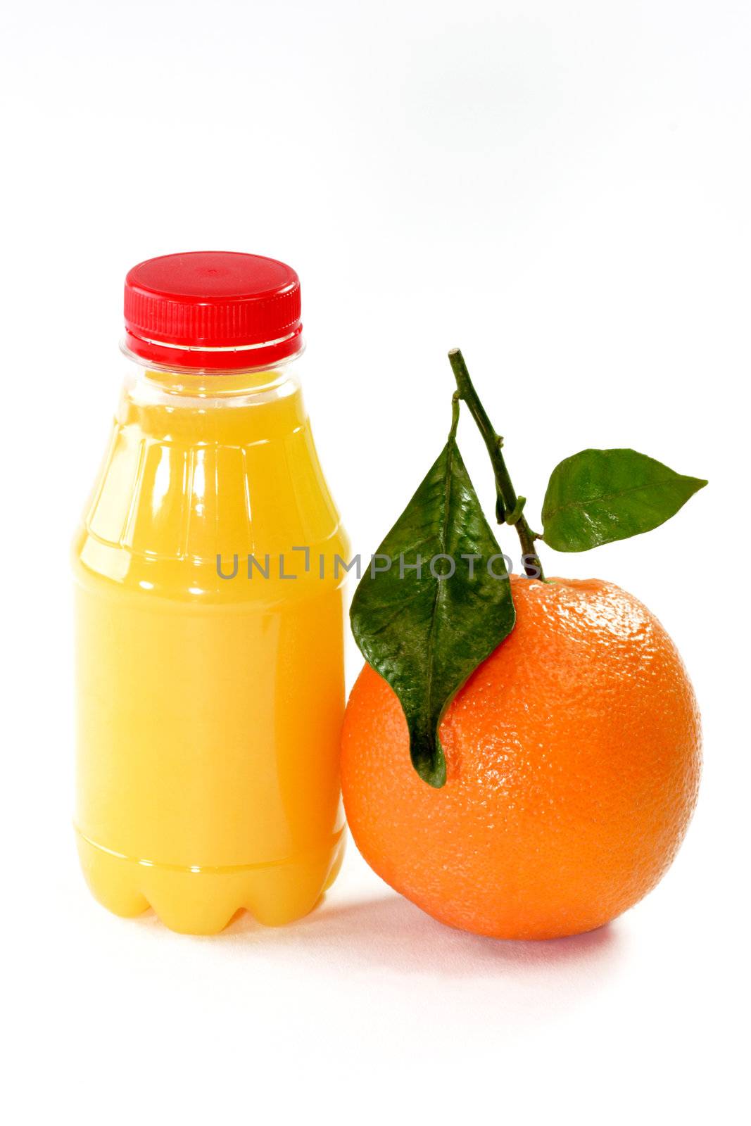 Fresh Orange with Orange Juice in the bottle on bright background. 